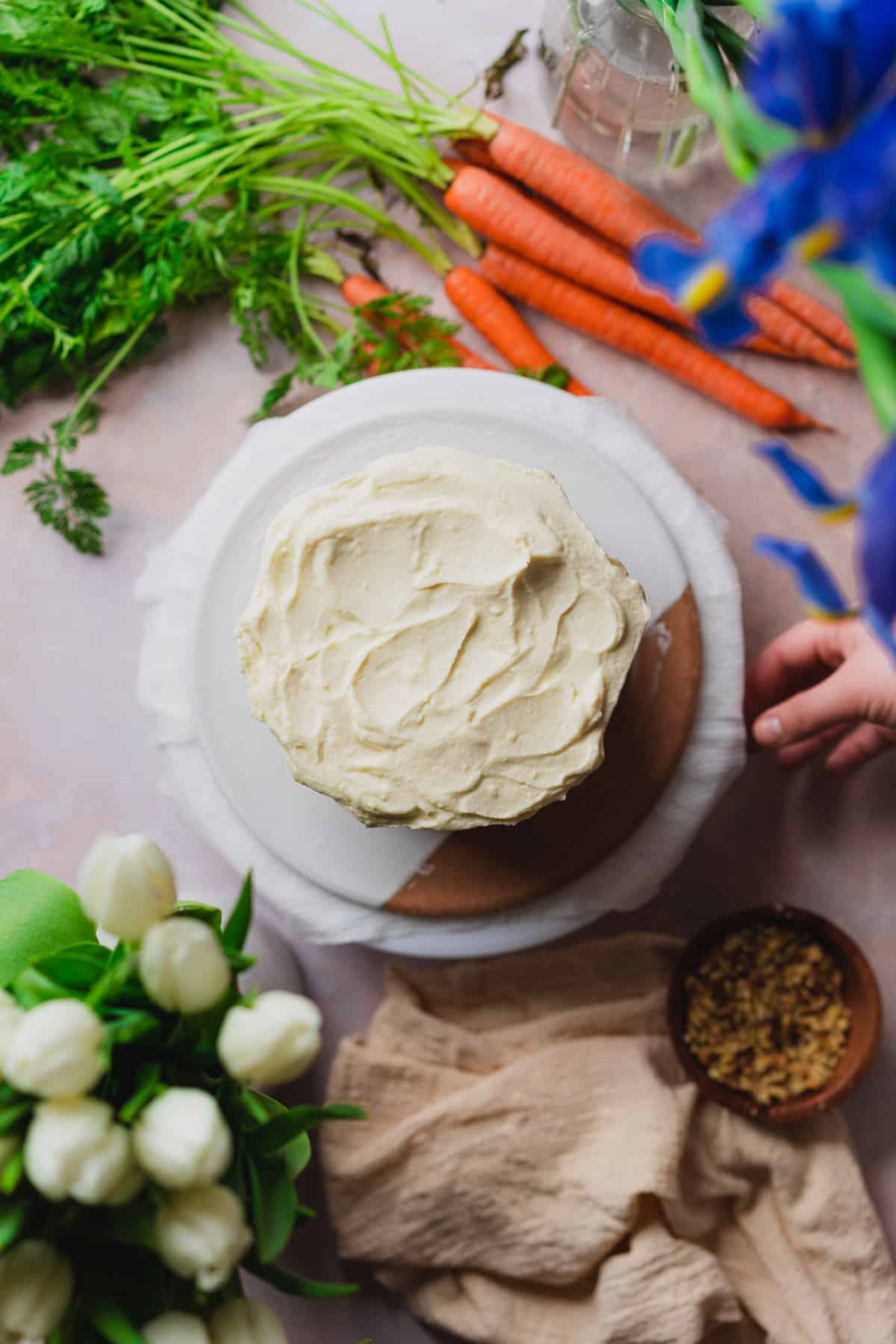 Frosted keto carrot cake with cream cheese frosting.