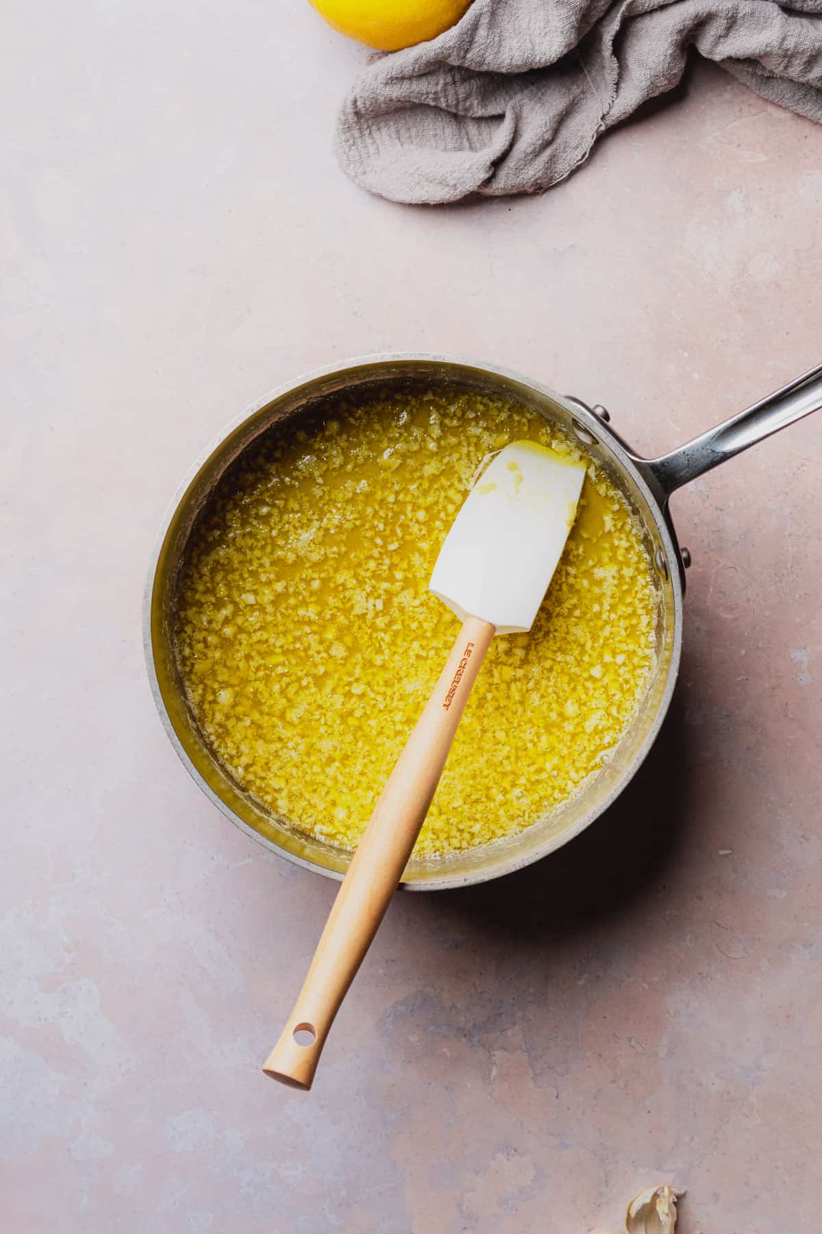 butter and garlic in a sauce pan with a rubber spatula. 