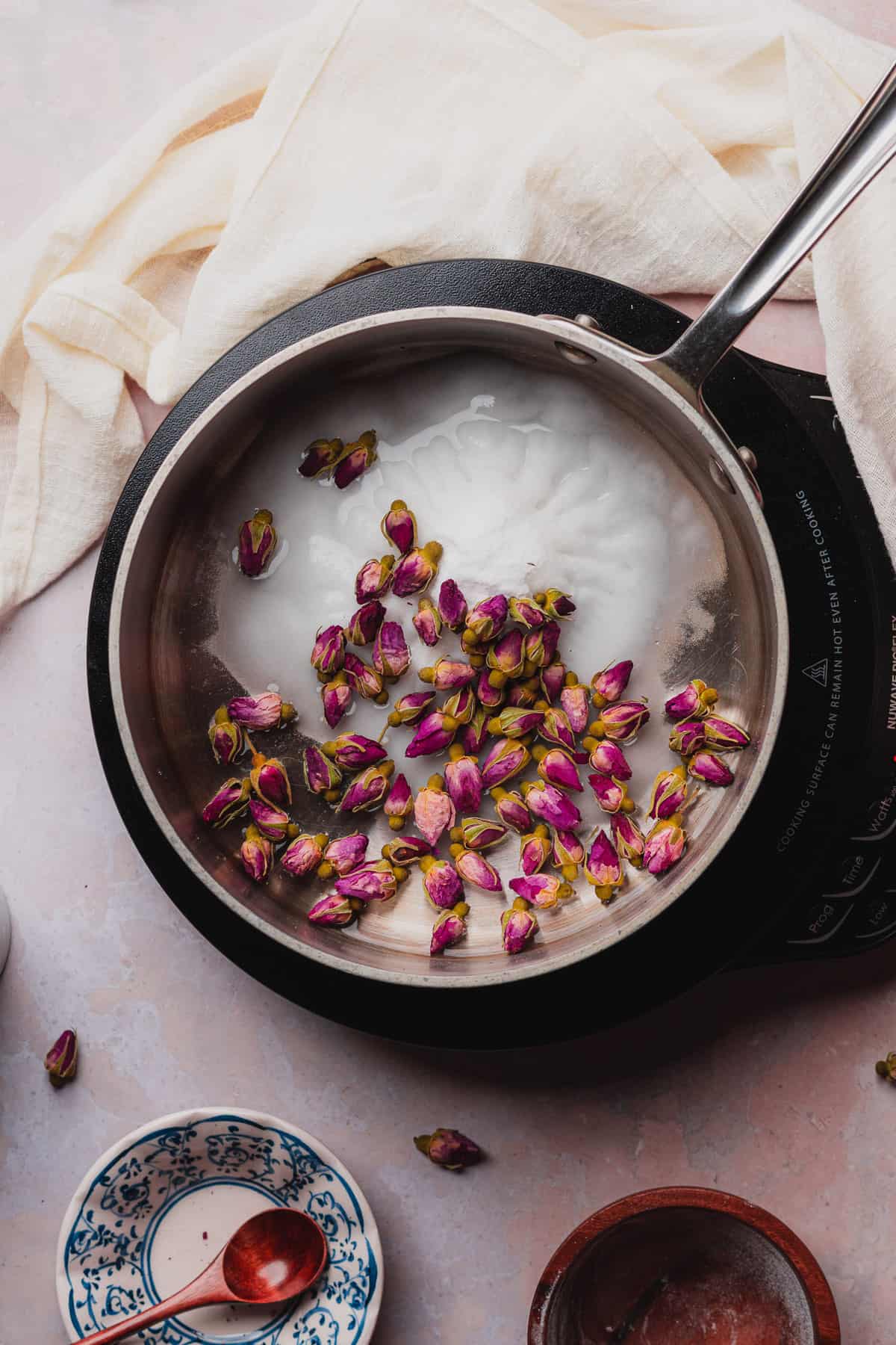 rosebuds, sweetener and water in a saucepan. 