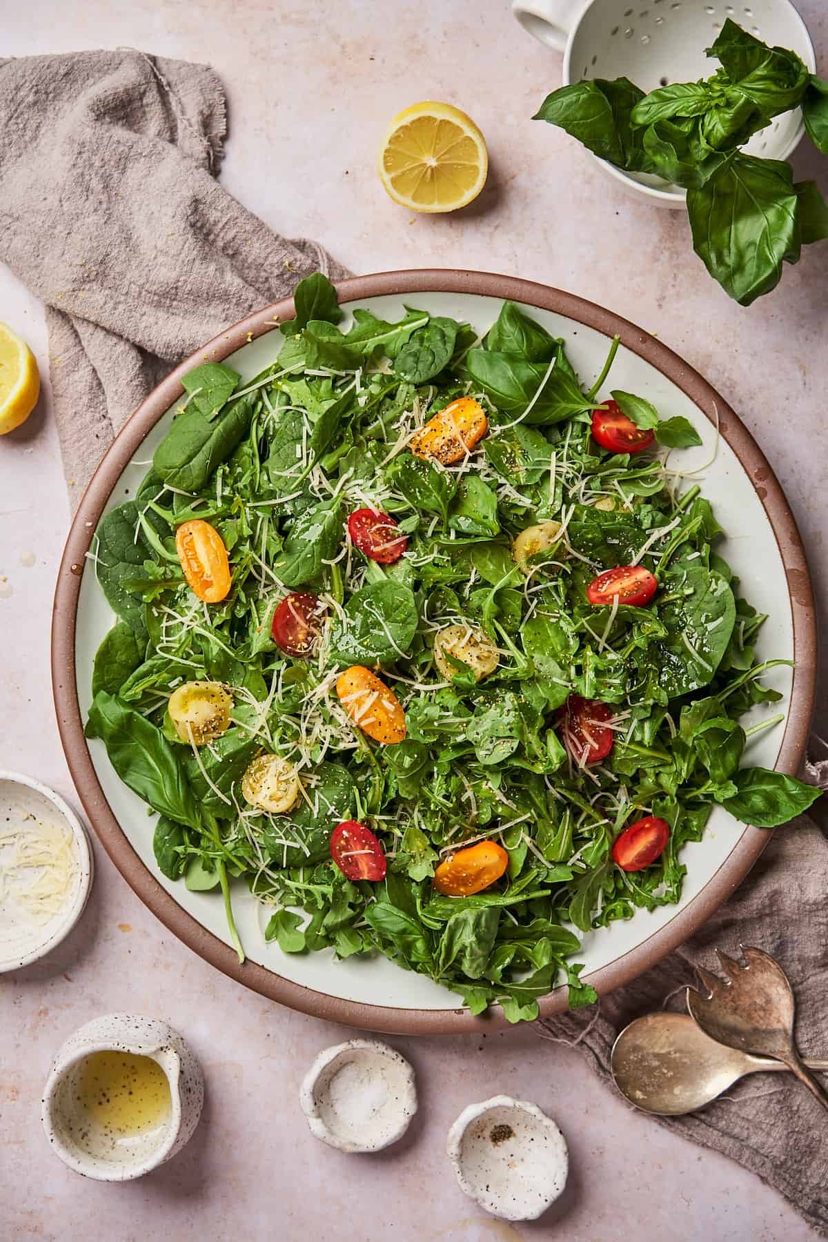 arugula spinach salad with tomatoes and parmesan.