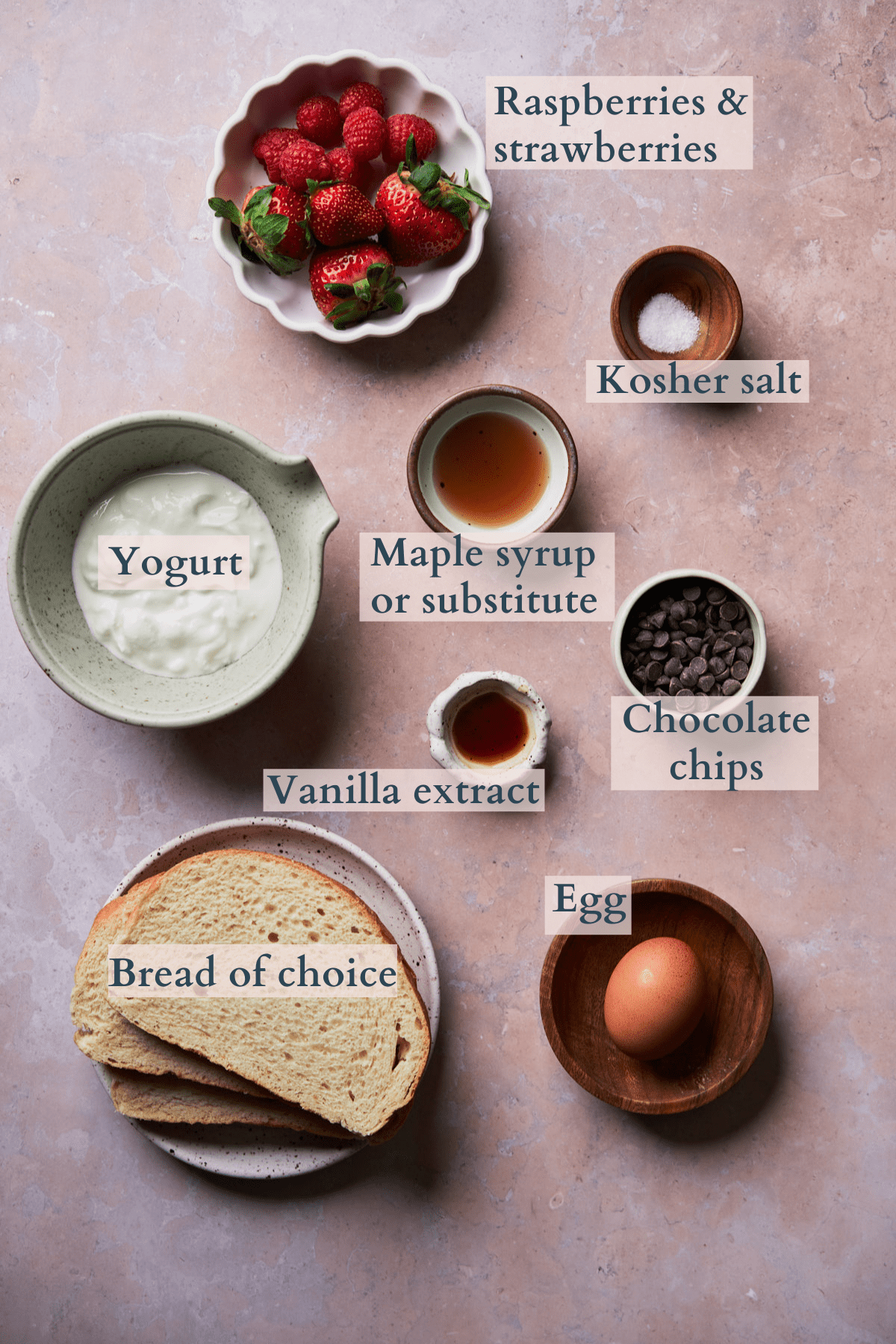 tiktok custard toast ingredients including egg, yogurt, vanilla extract, maple syrup substitute, strawberries, raspberries, kosher salt, chocolate chips, and bread.