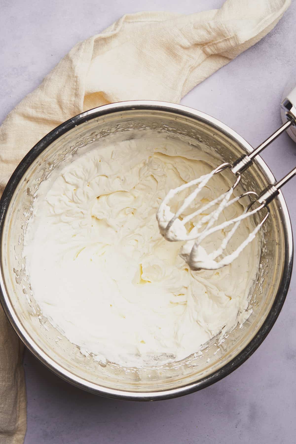 heavy cream whipped with a mixer in a metal bowl until stiff peaks form. 