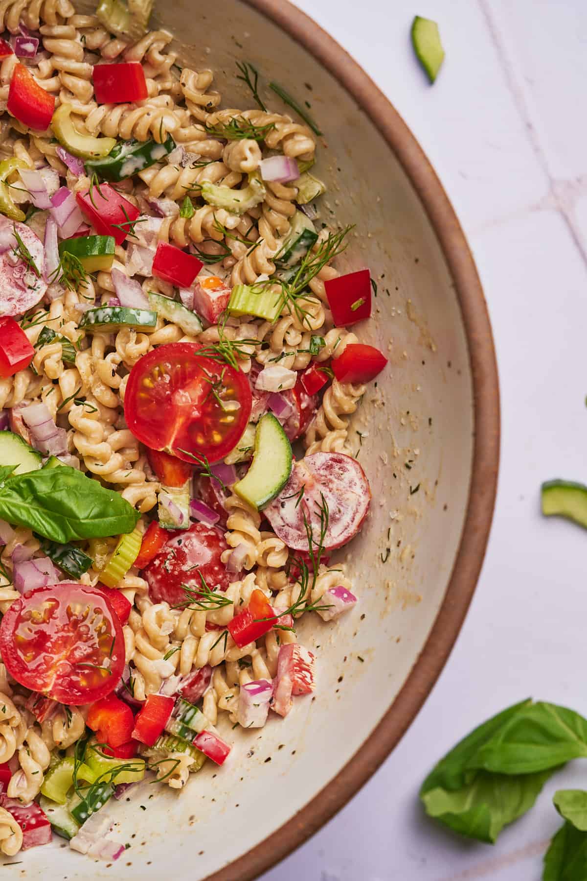 creamy pasta salad in a large mixing bowl. 