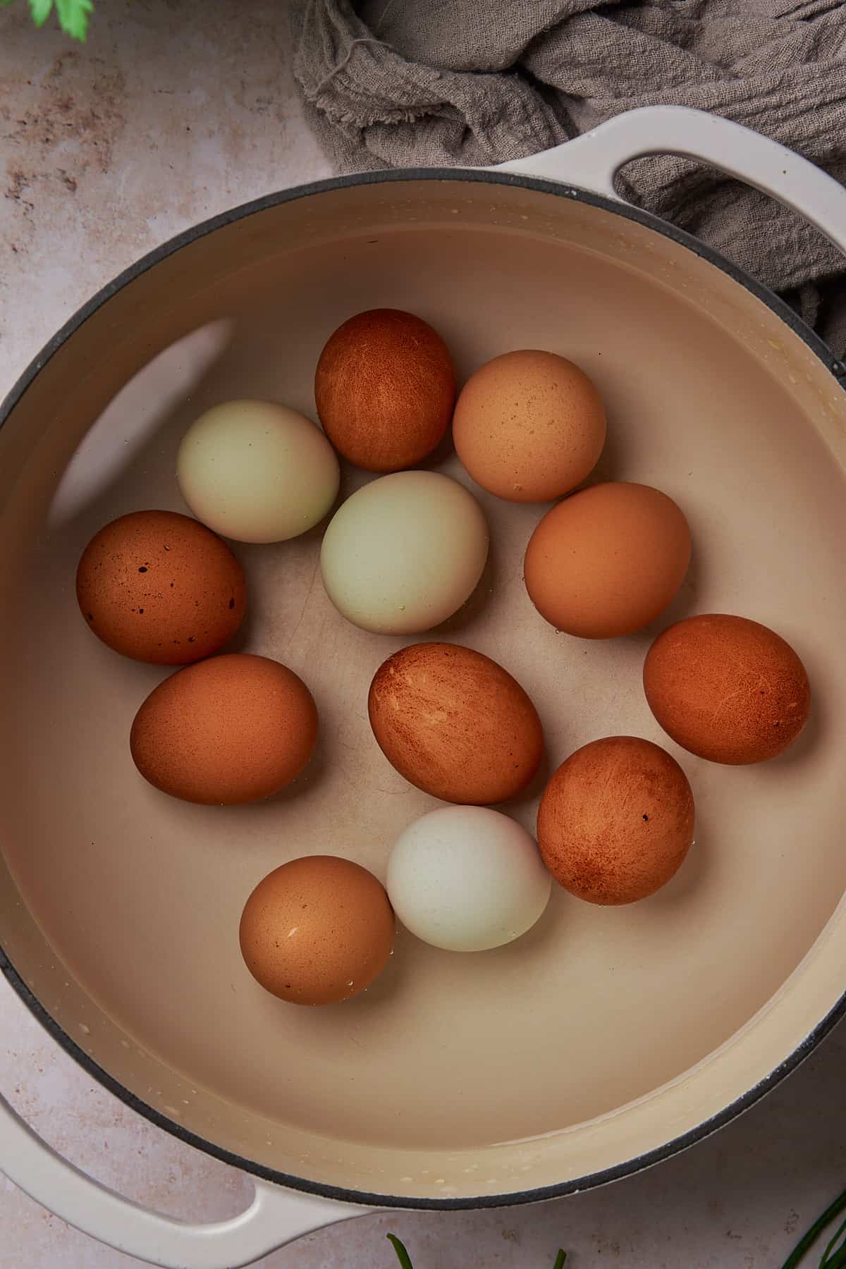 whole eggs in a container with water. 
