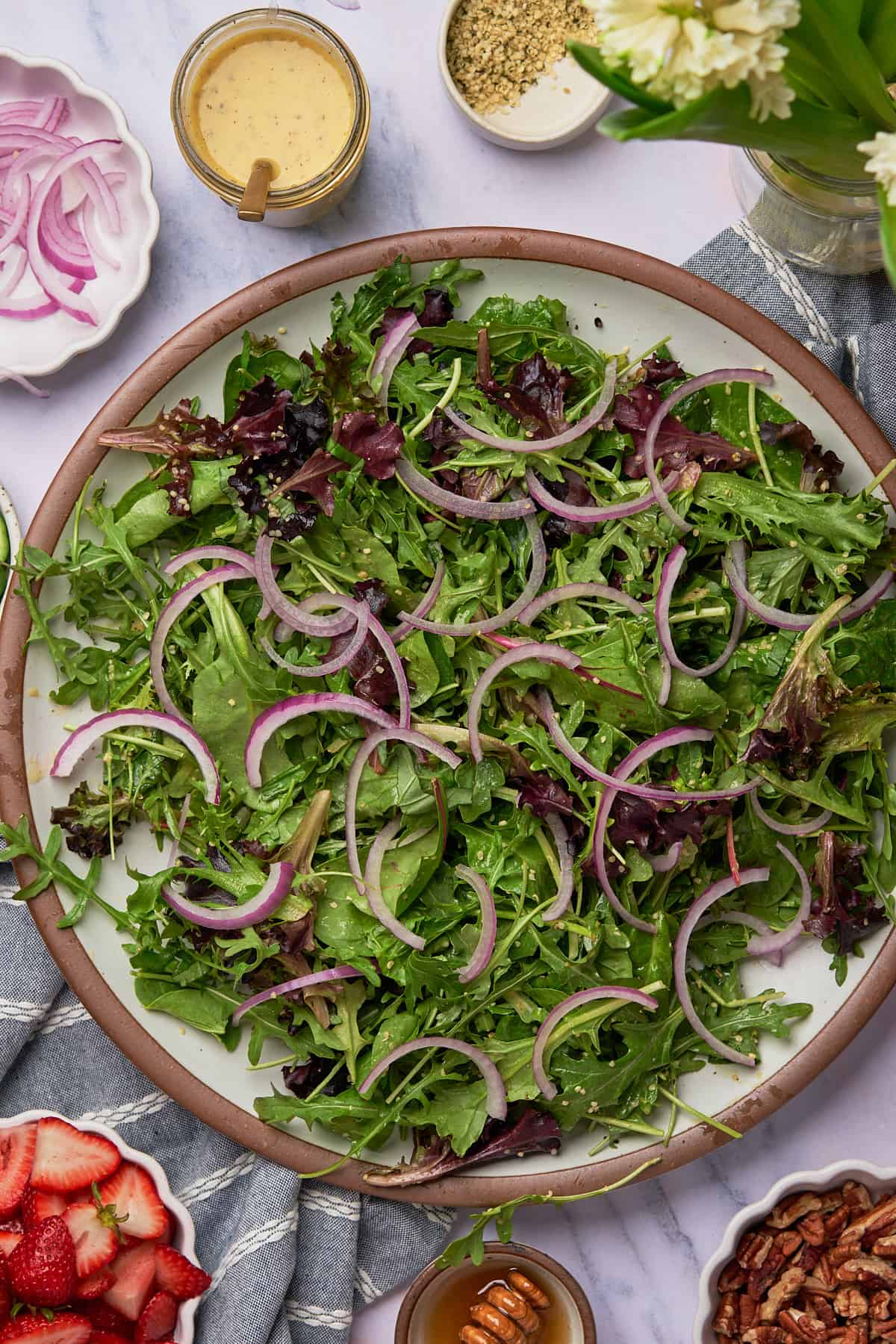 spring mix with red onions over top. 