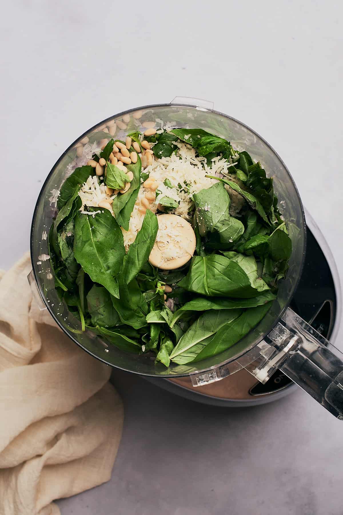 basil, parmesan cheese, lemon zest in a food processor.