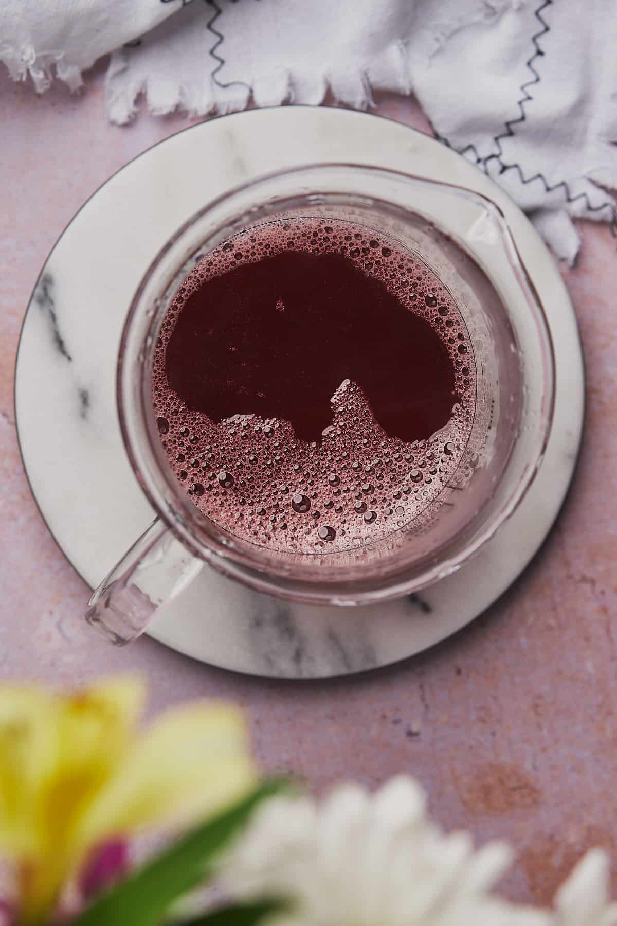 strawberry syrup in a glass container. 