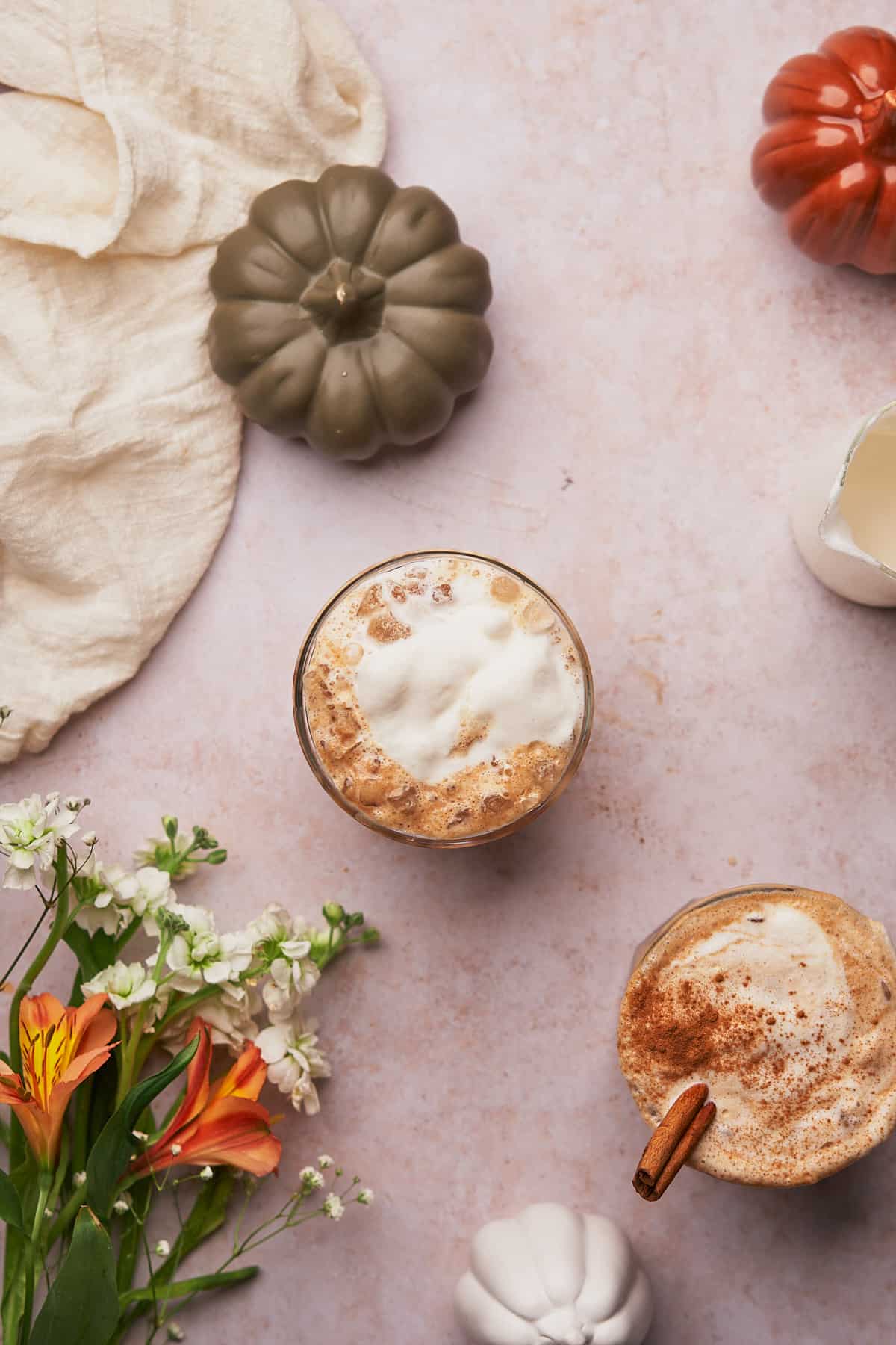 pumpkin iced latte topped with a maple foam, and cinnamon.