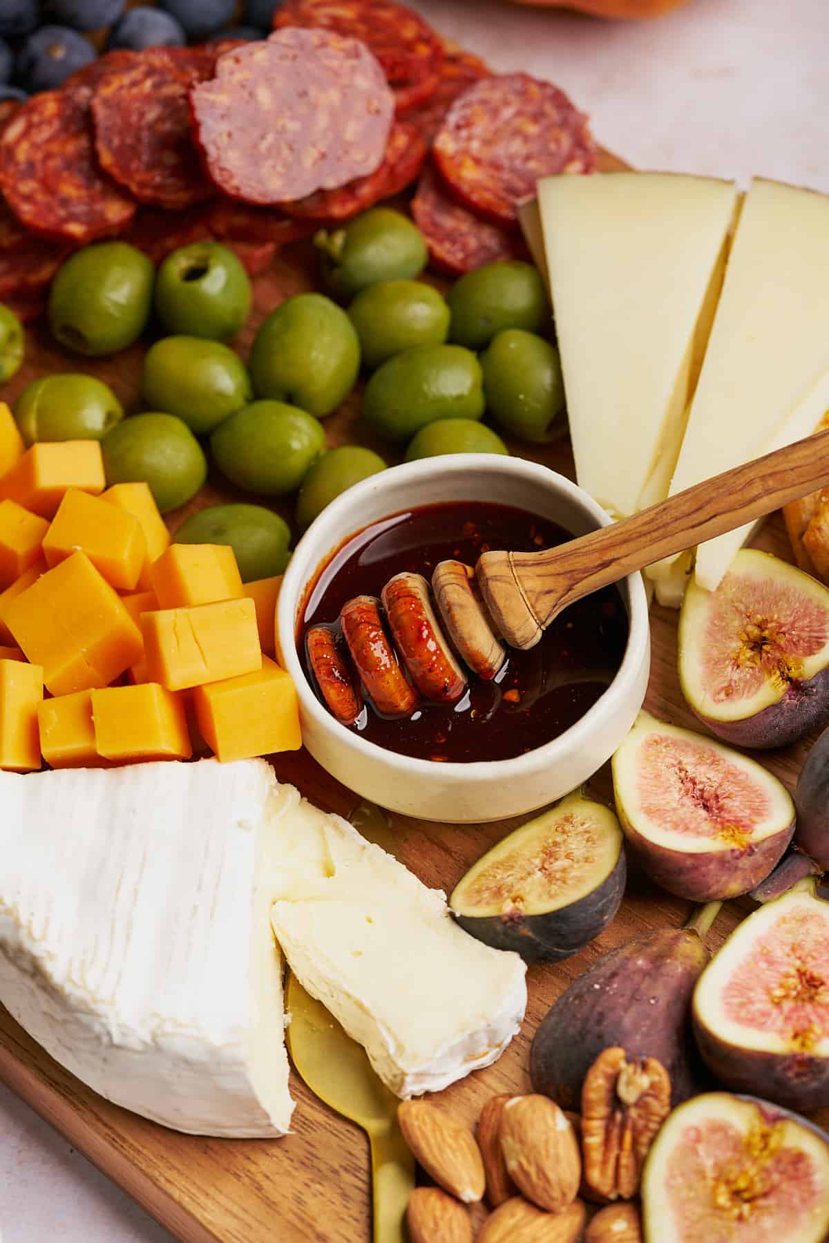 hot honey near figs, brie cheese, and manchego.