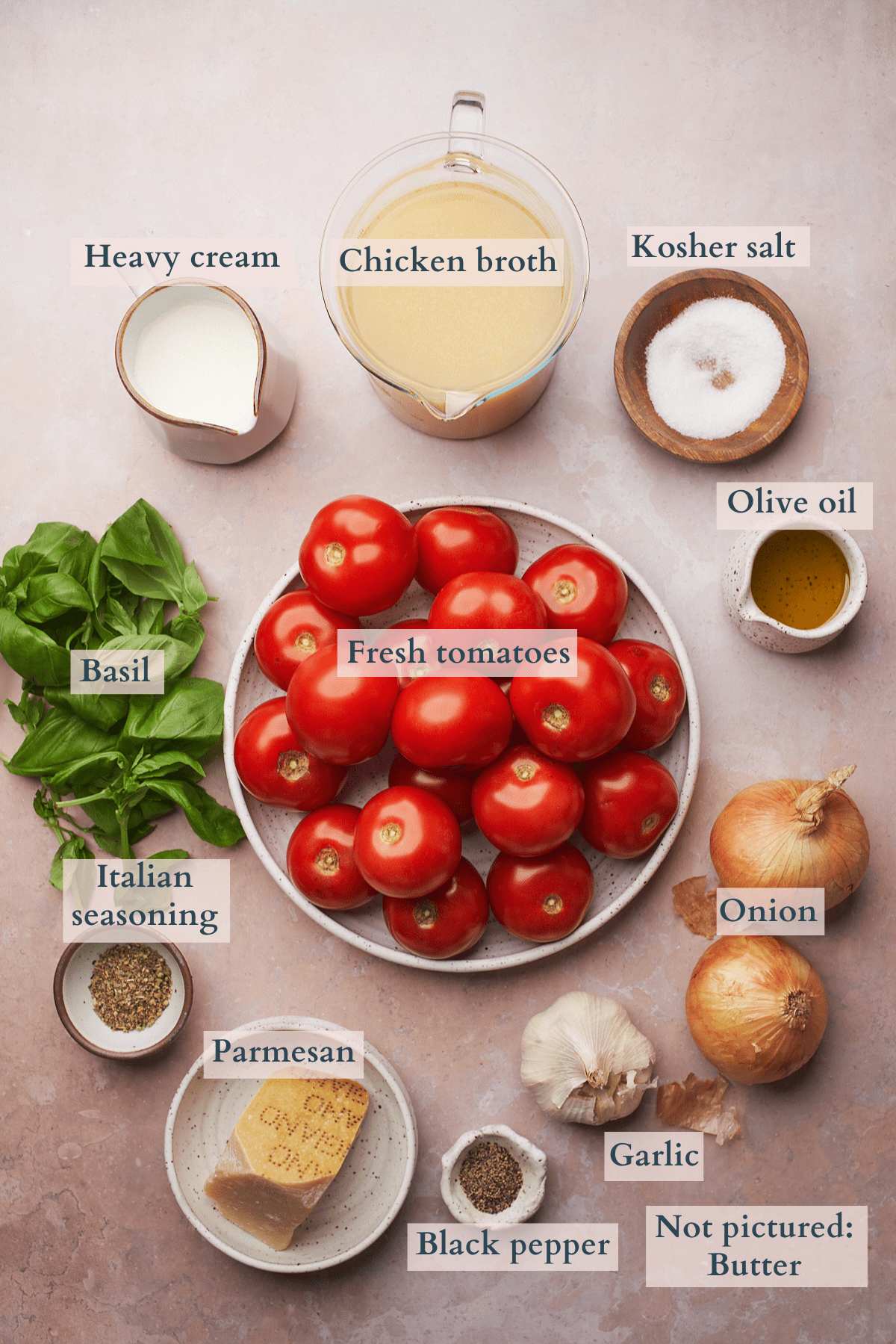 ingredients to make keto tomato soup laid out with text overlaying the ingredients to denote each ingredient. 