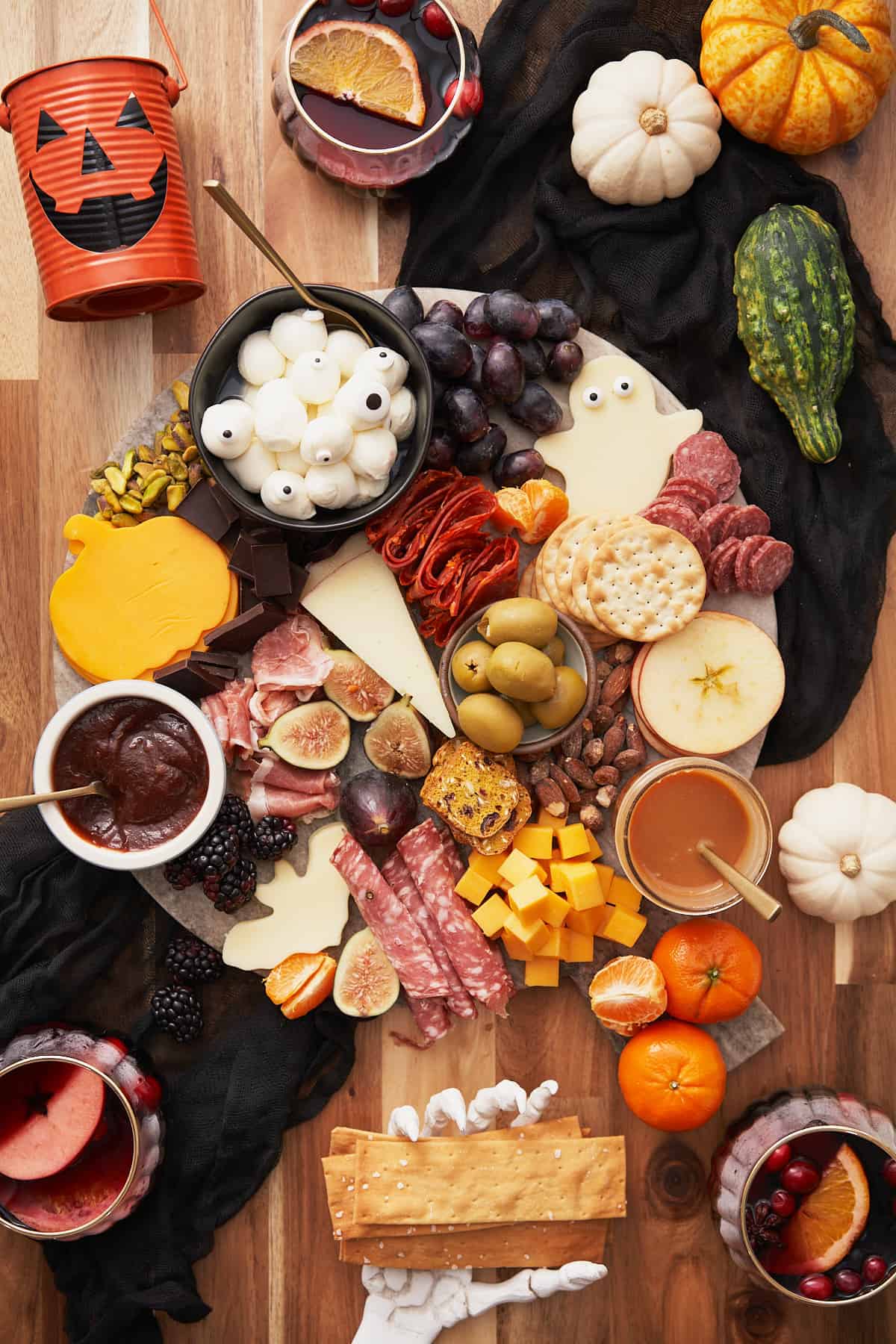 spooky halloween charcuterie board with a variety of fun and seasonal items. 