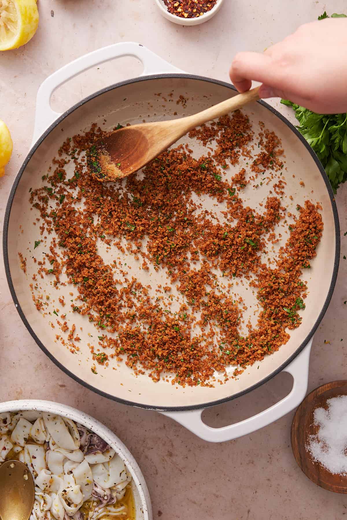 toasted breadcrumbs in a skillet with parsley. 