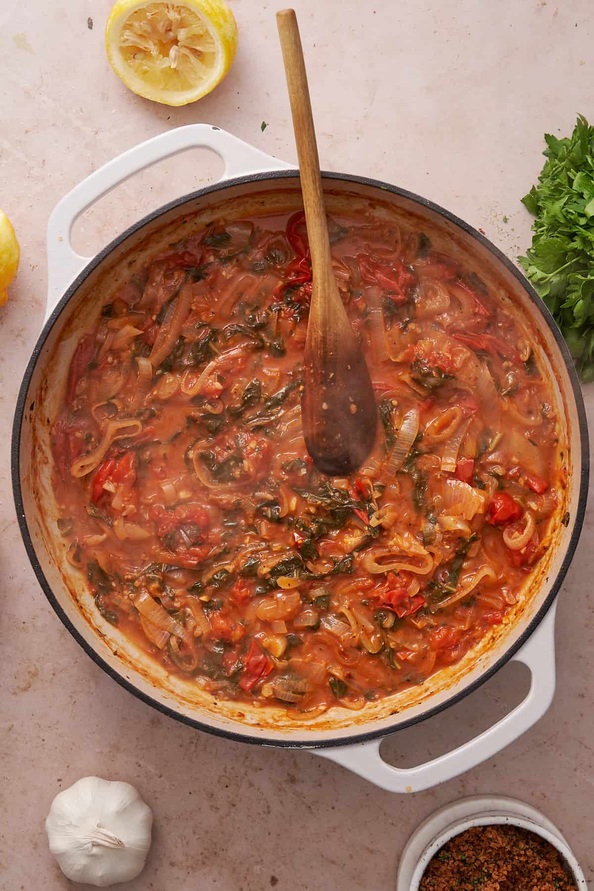 tomato sauce with shallots, garlic, seasonings, and fresh basil in a skillet. 