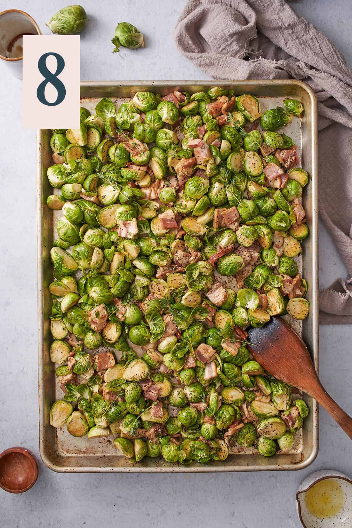 brussels sprouts and bacon in a single layer on a large baking sheet.