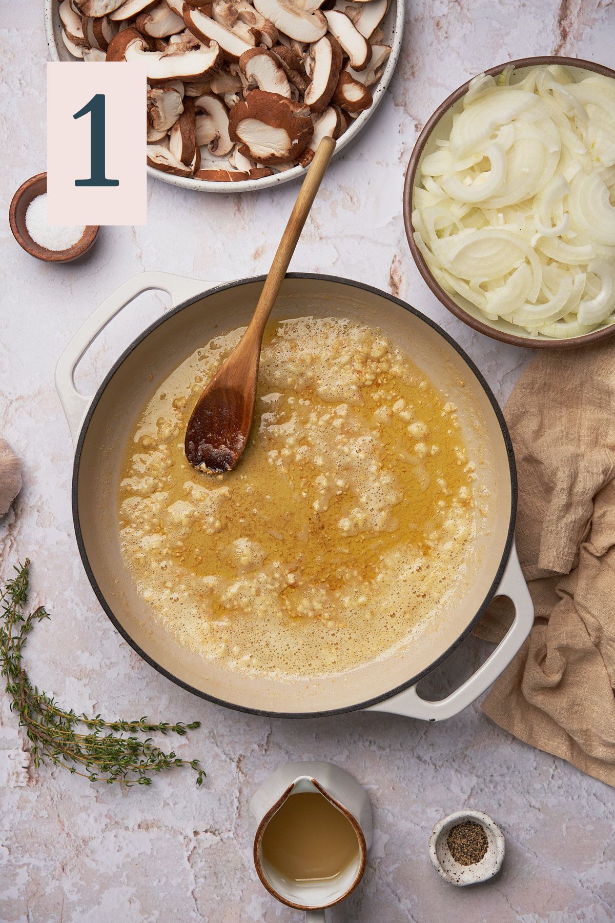 butter and olive oil melted in a skillet with garlic. 