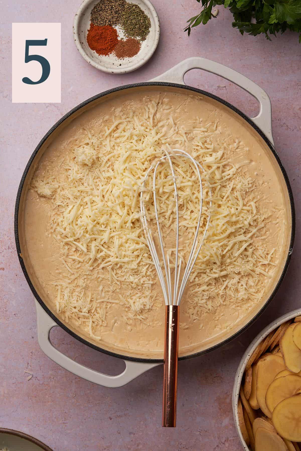 whisk in a skillet with a cream sauce and freshly grated cheese.