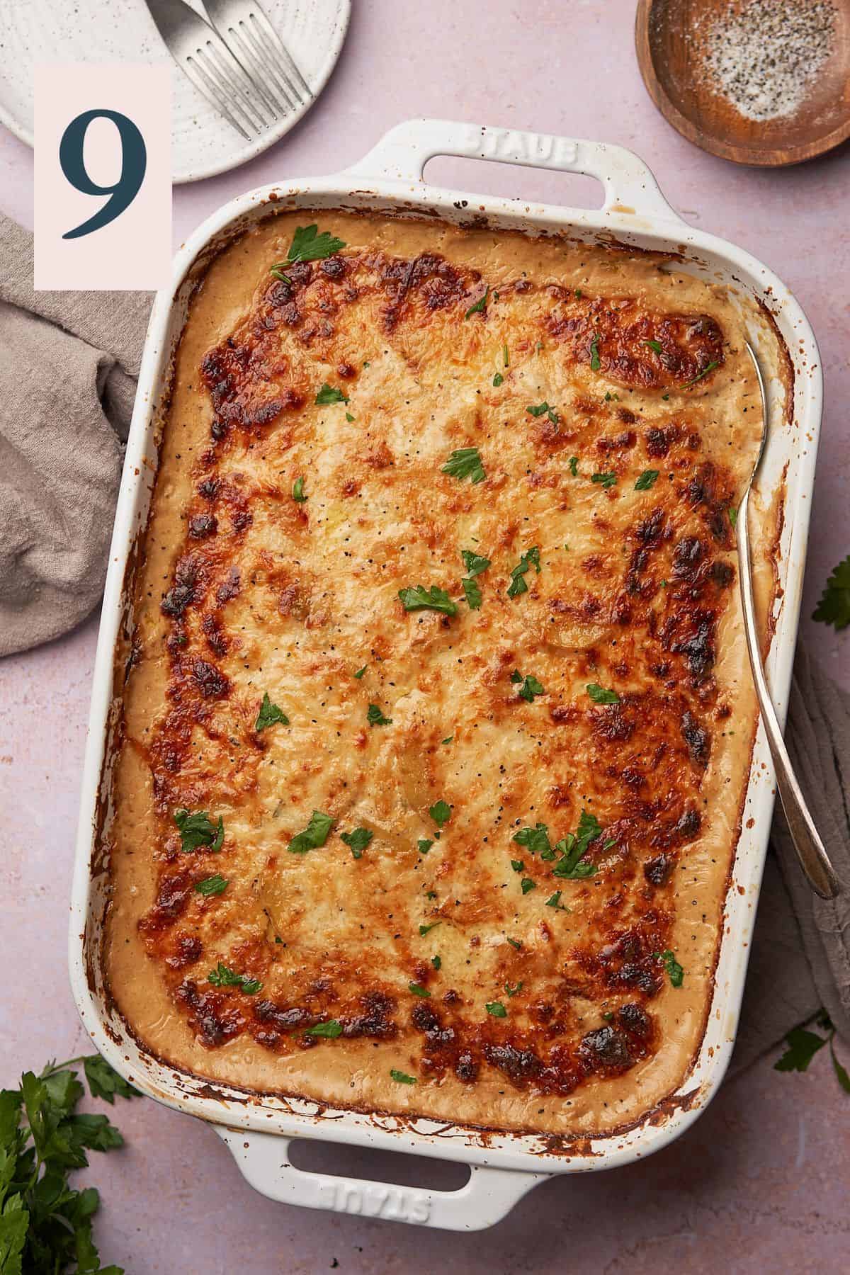 baked cheesy scalloped potatoes in a casserole dish. 