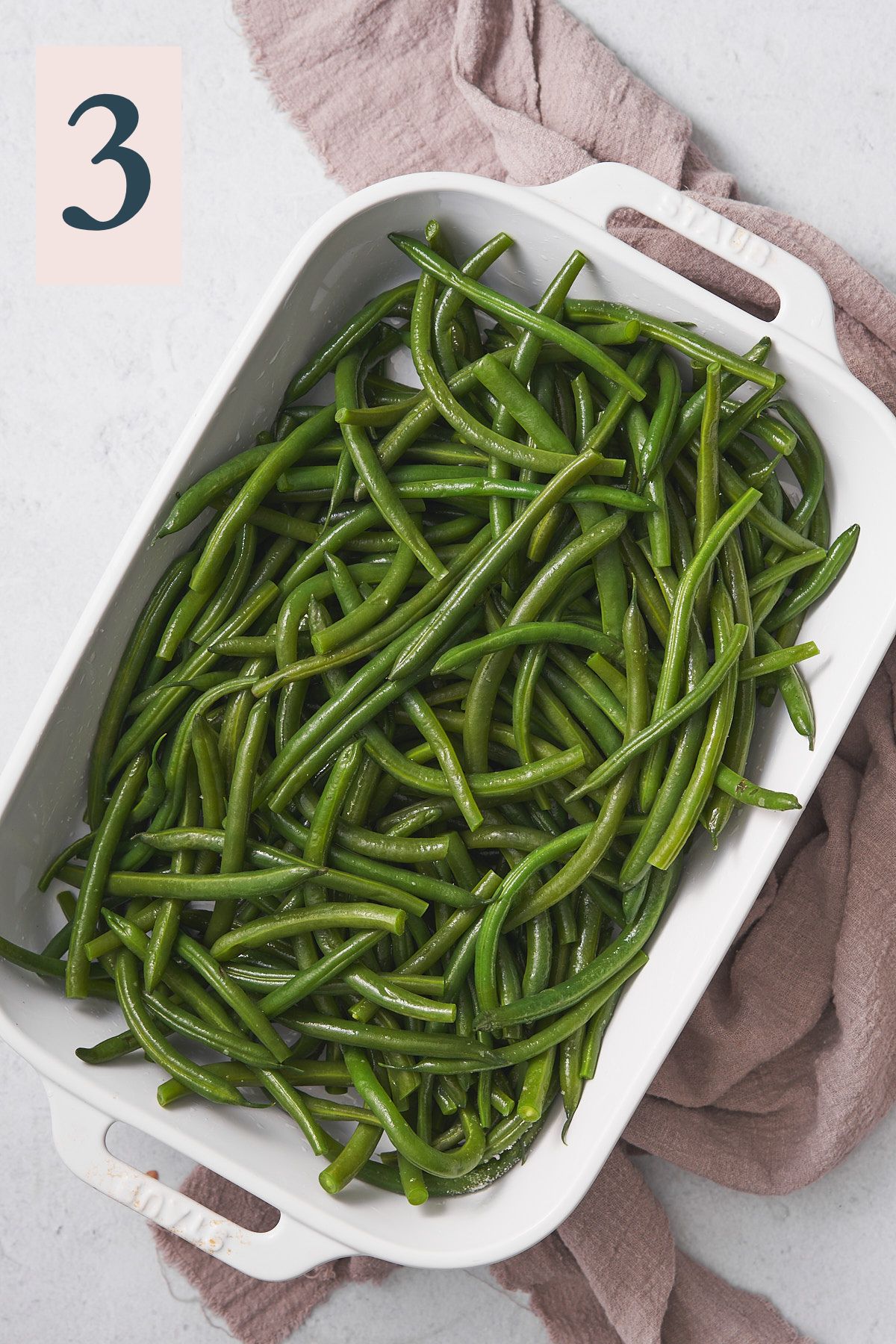 green beans in a large casserole dish. 