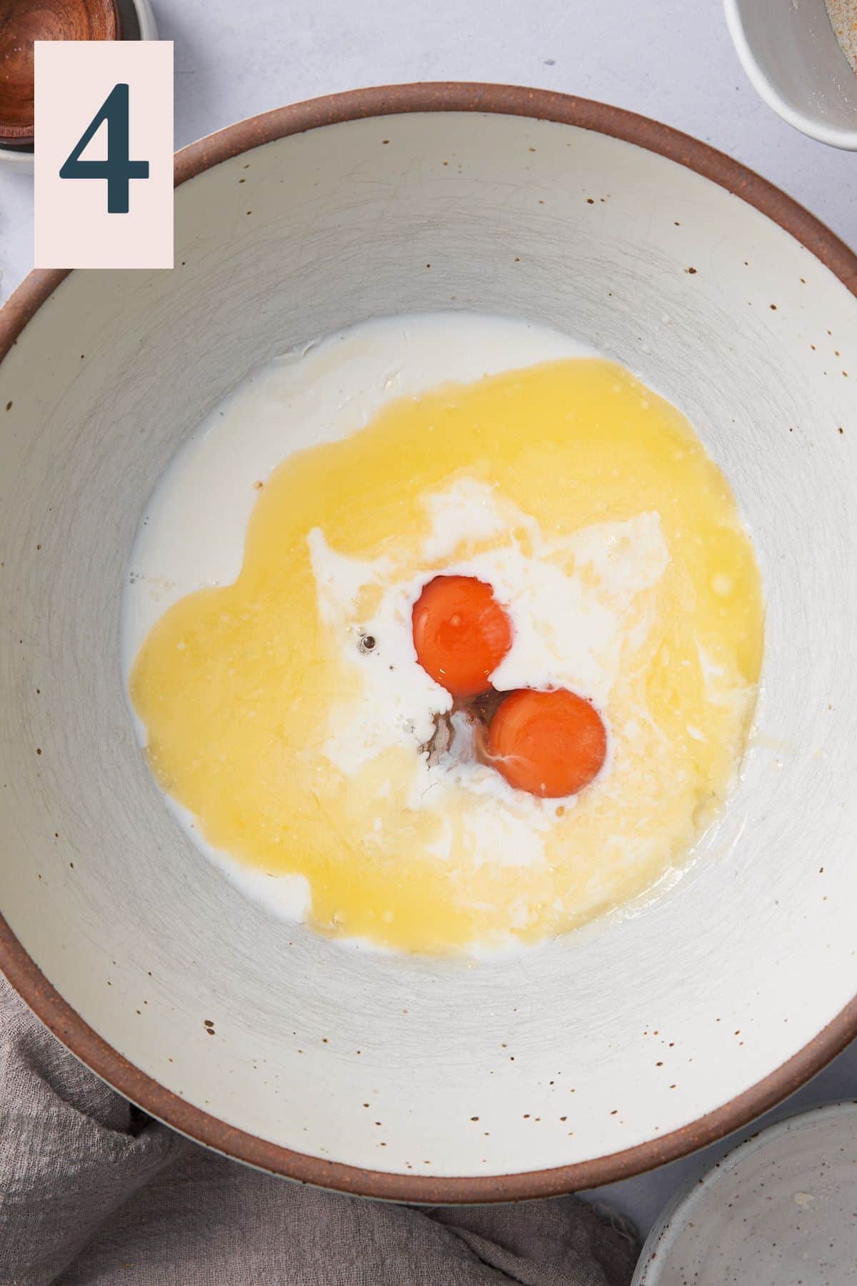 butter, milk, and eggs in a large mixing bowl. 