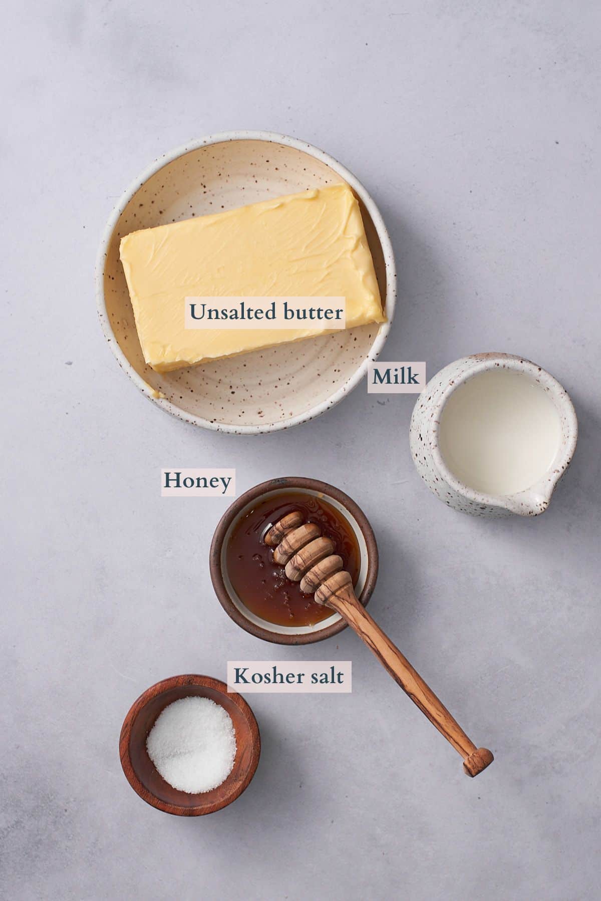 ingredients to make whipped honey butter with text to denote each ingredient. 