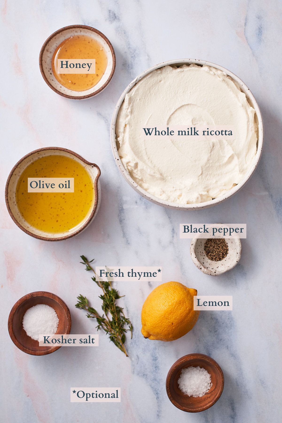 ingredients to make whipped ricotta, with text overlaying to denote each ingredient. 