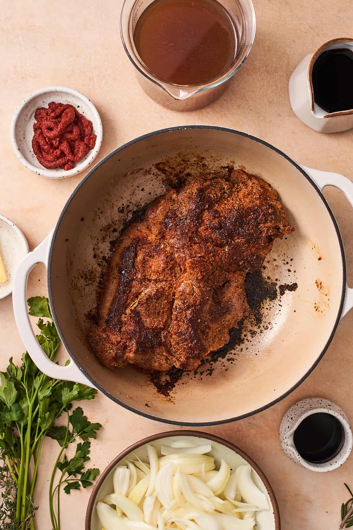 chuck roast browned on a few sides in a dutch oven.