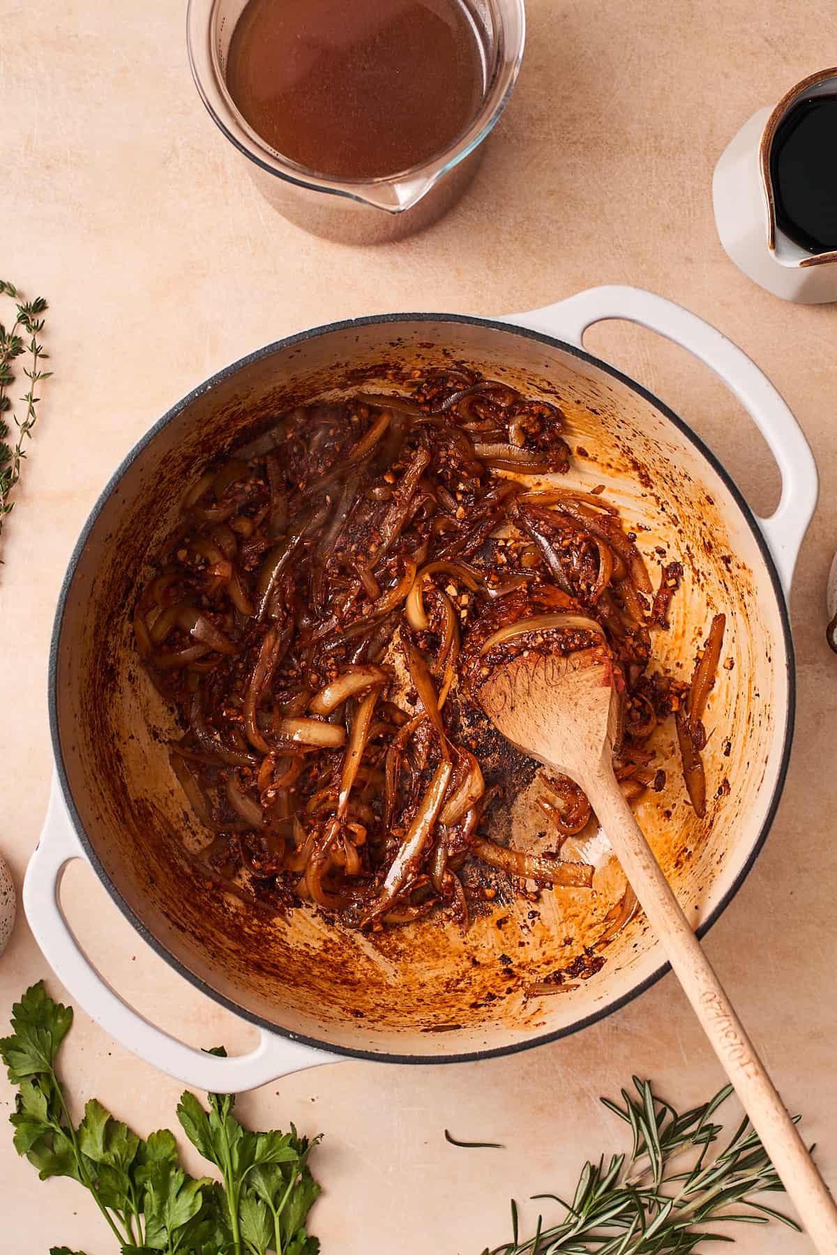 cooked onions in a cast iron skillet with tomato paste.