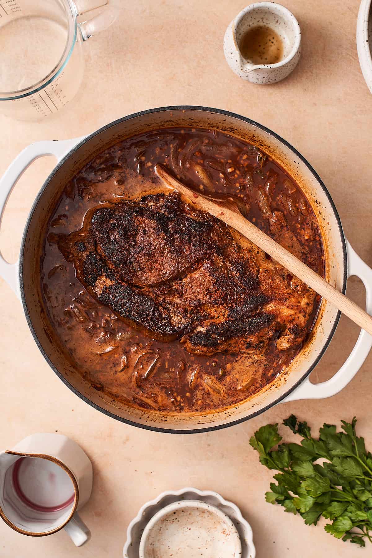 beef chuck roast in a braising liquid with onions and beef broth.
