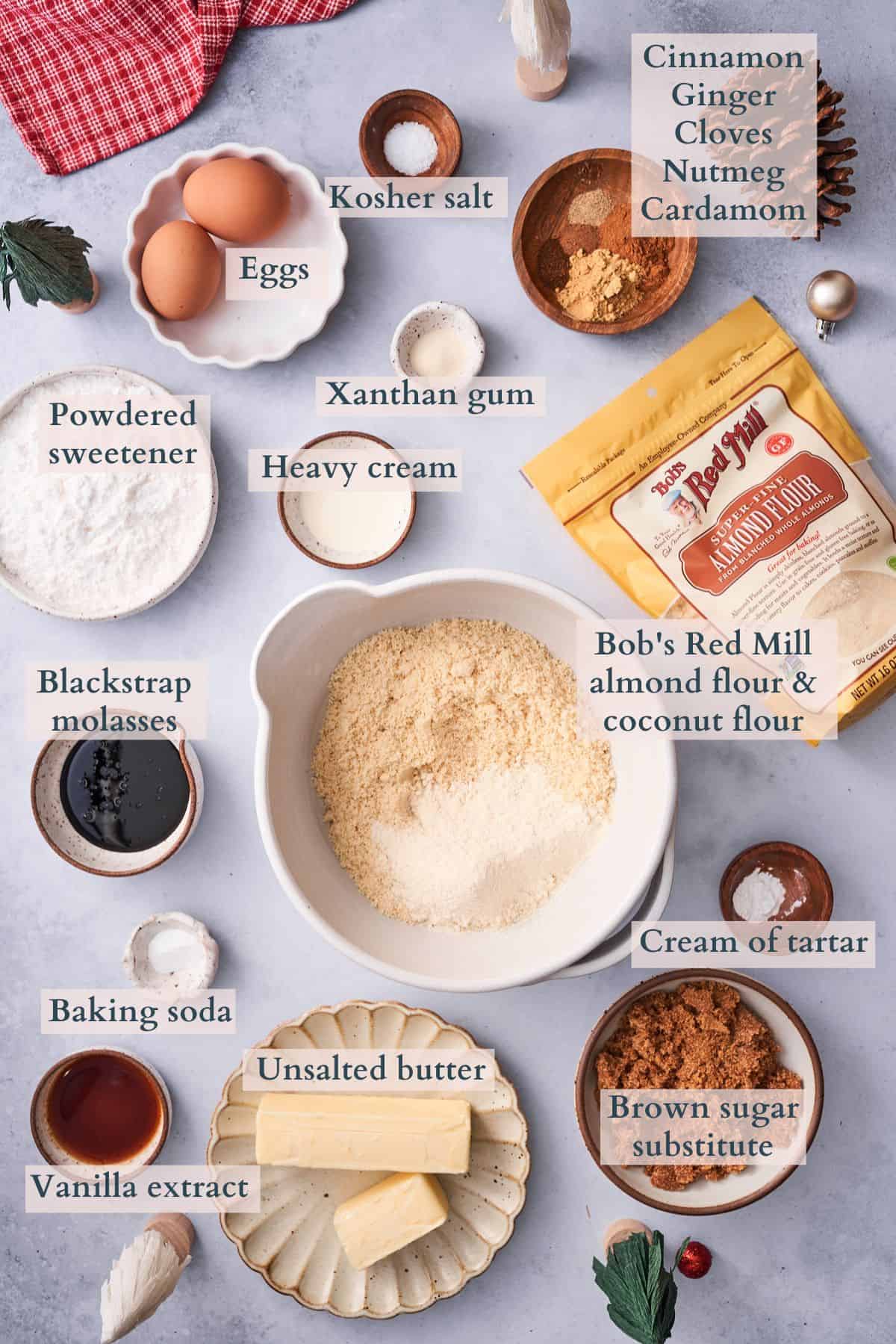 ingredients to make keto gingerbread cookies with text to denote different ingredients.