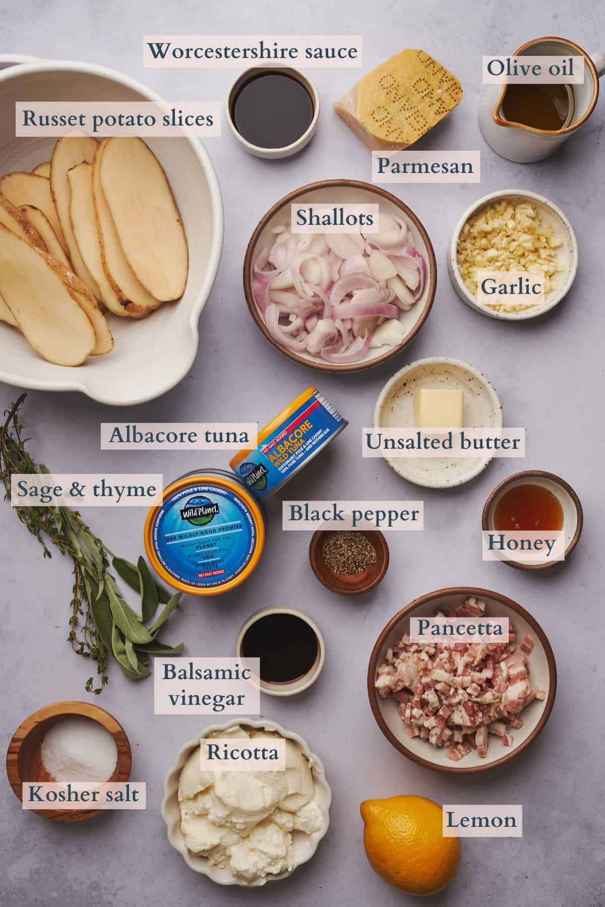 ingredients to make a tuna mousse appetizer with all of the ingredients laid out in small bowls and plates with text overlaying to denote each ingredient. 