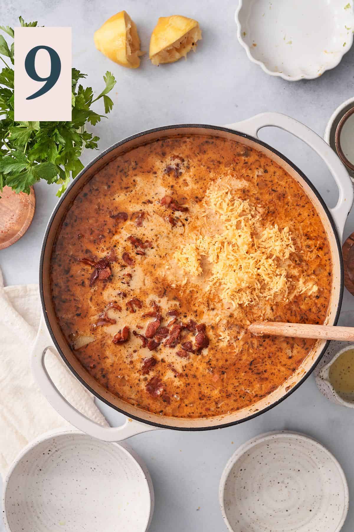 cheese, cream, and bacon added to a dutch oven. 