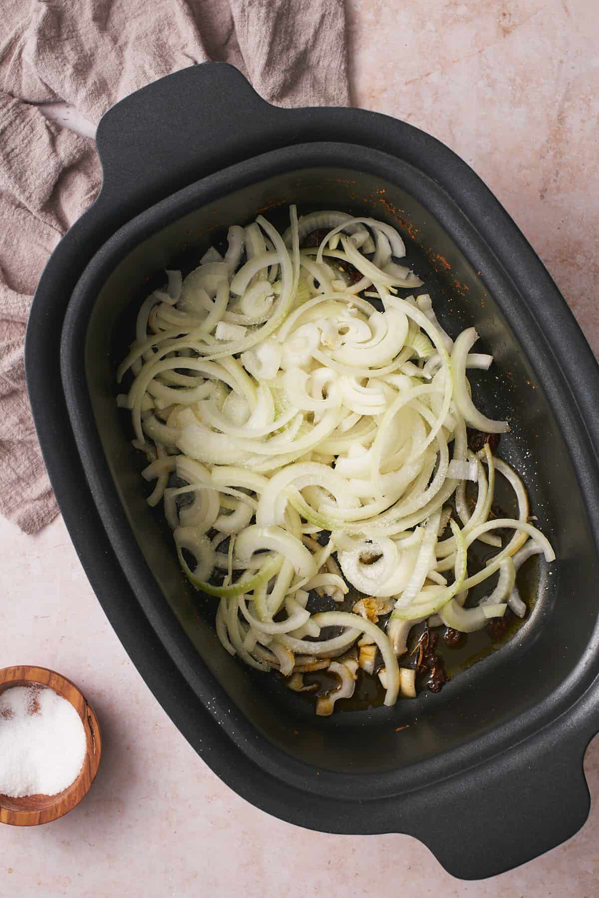 Raw onions in a slow cooker.
