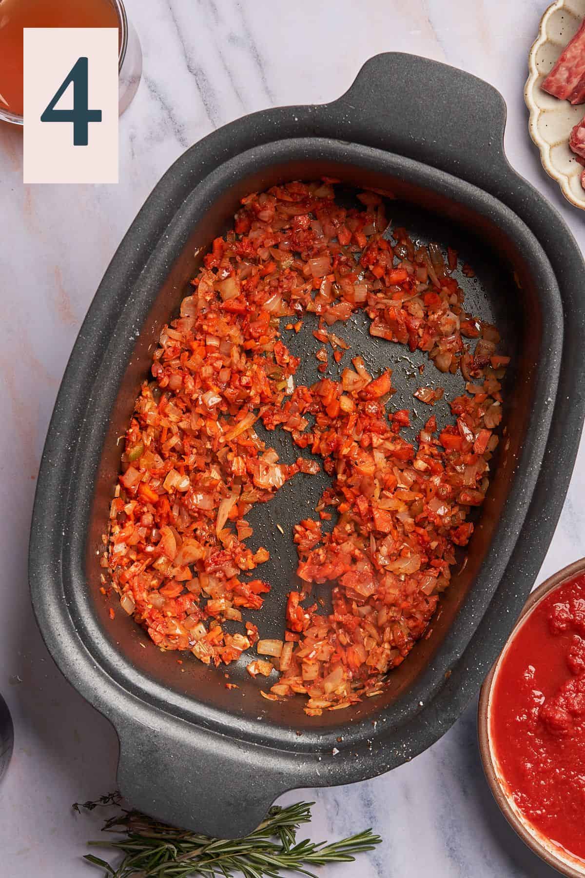 cooked vegetables with tomato paste in a slow cooker. 