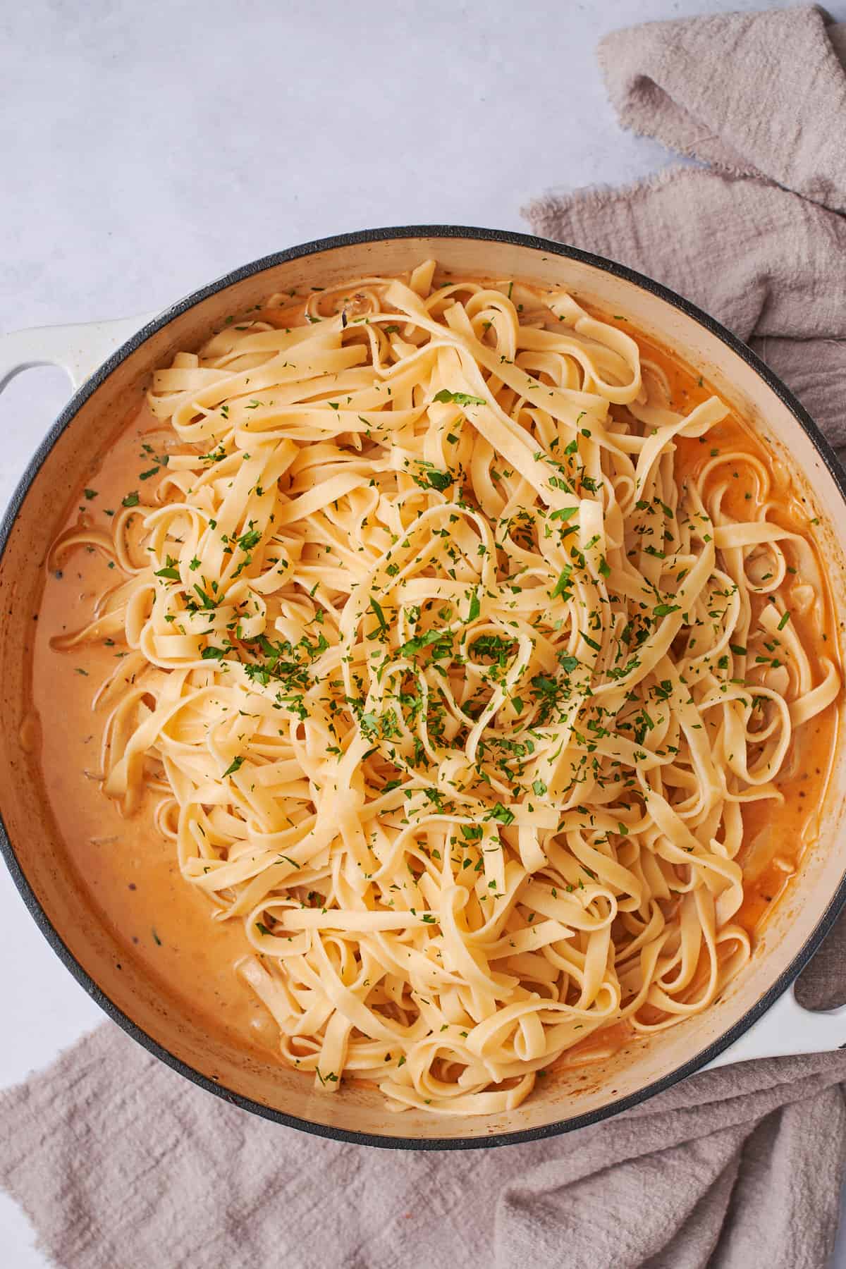 pasta in a cream sauce with parsley.