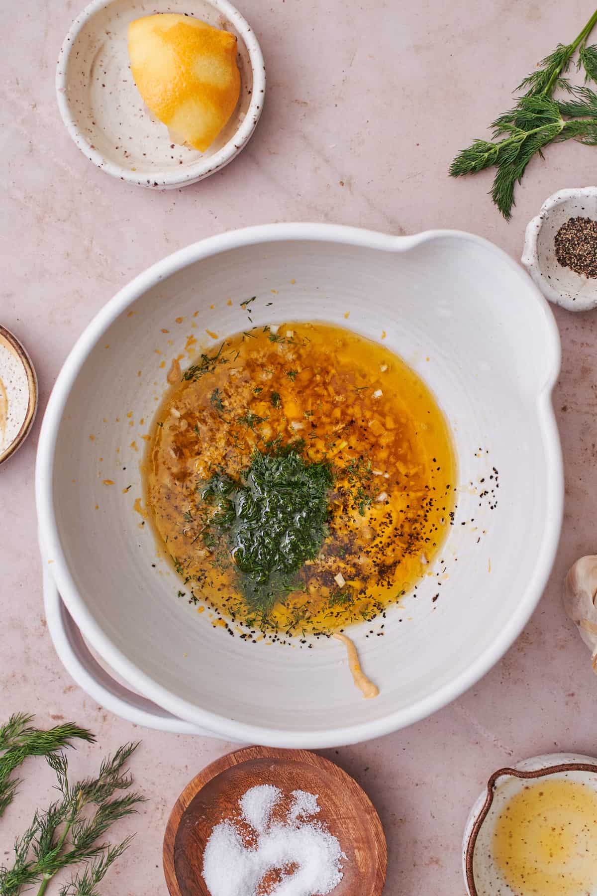 lemon juice, zest, olive oil, garlic, shallots, honey, salt, dill, and Dijon mustard in a large mixing bowl.