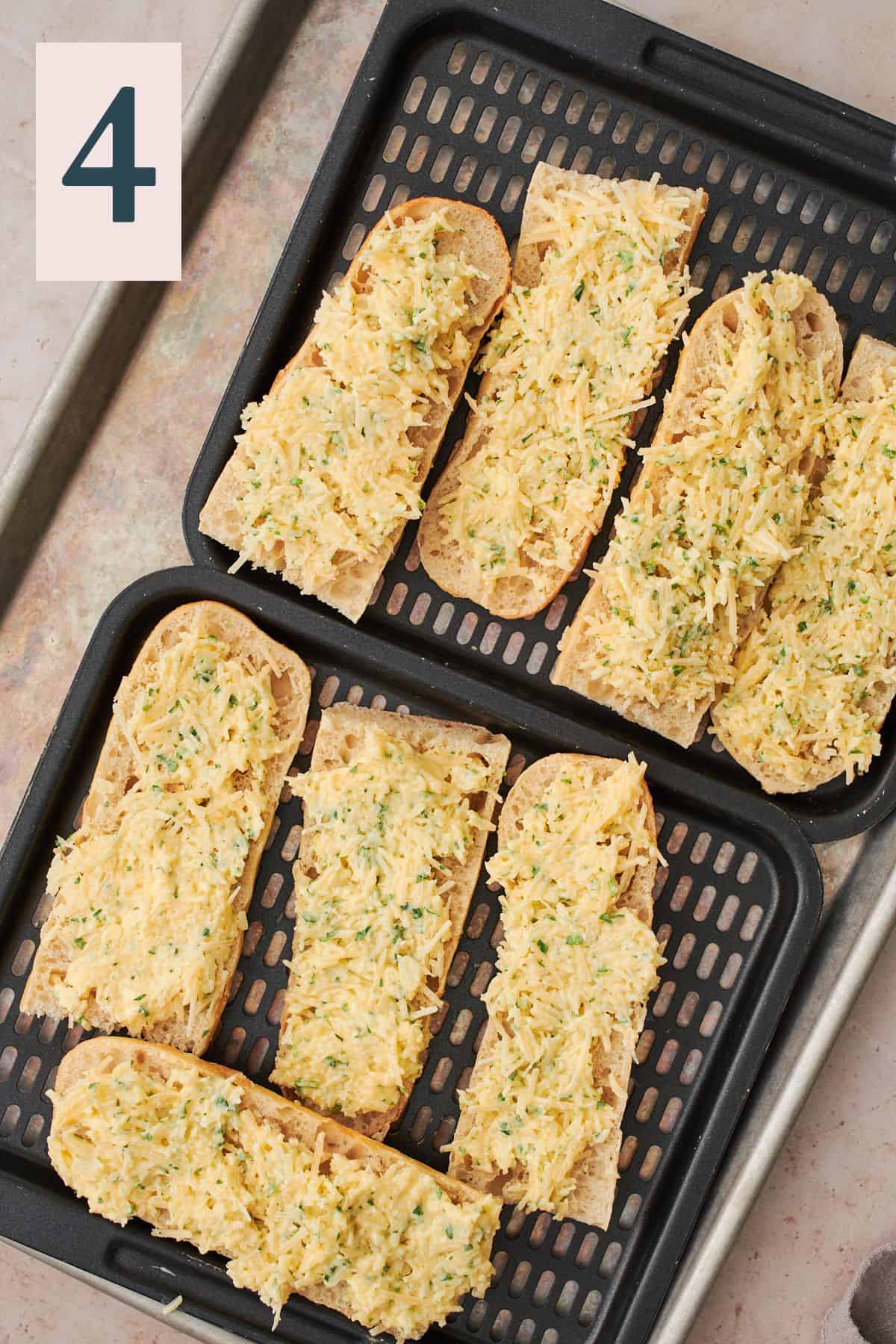 bread with garlic butter on air fryer trays and unbaked. 
