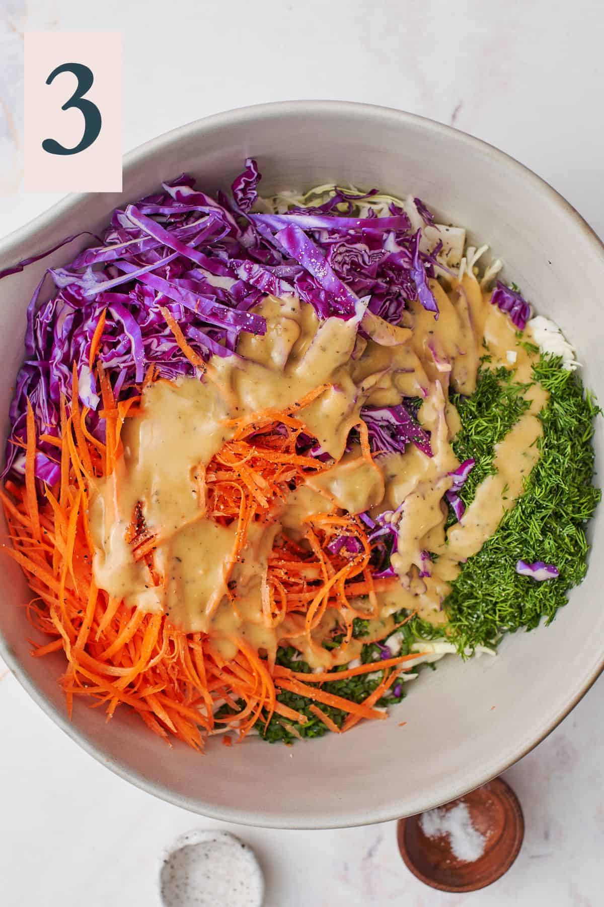 honey lemon dressing added to a cabbage and carrot salad with fresh herbs. 