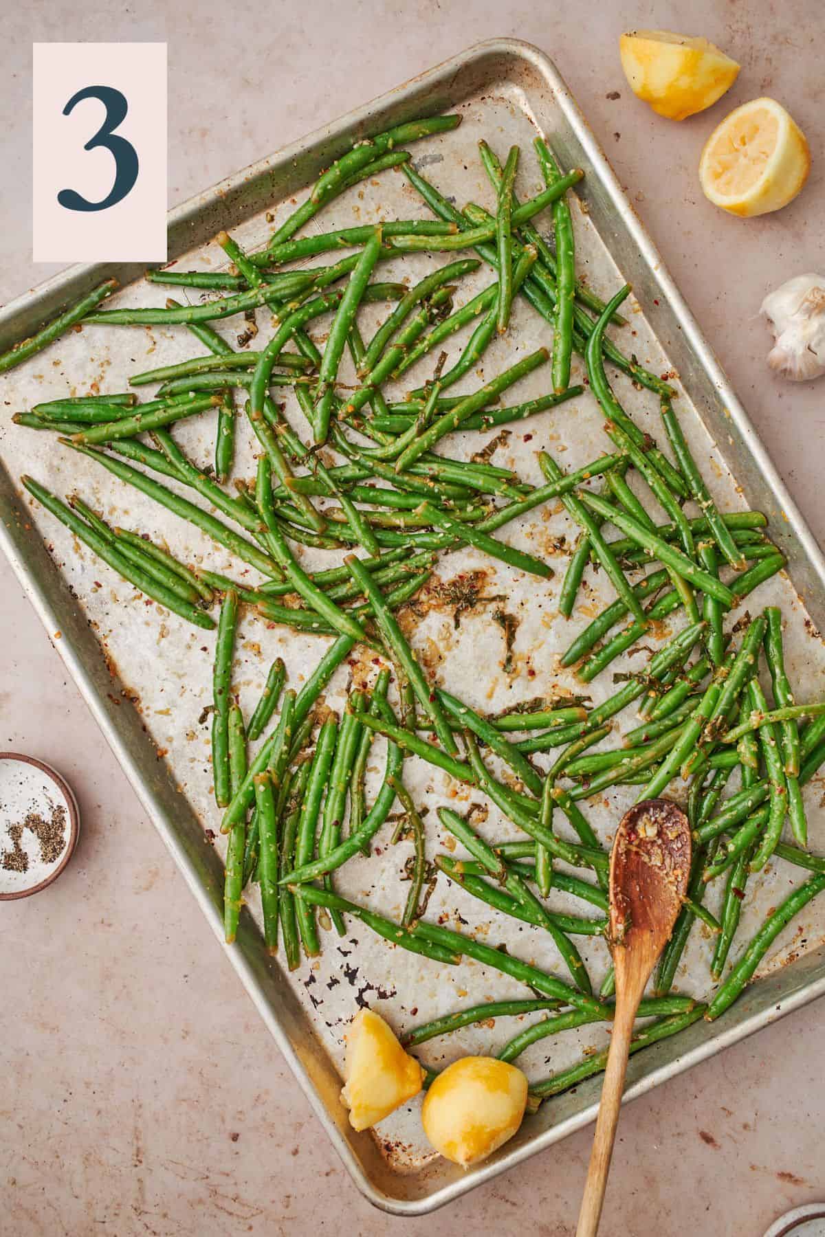 Roasted green beans topped with more lemon juice and basil.