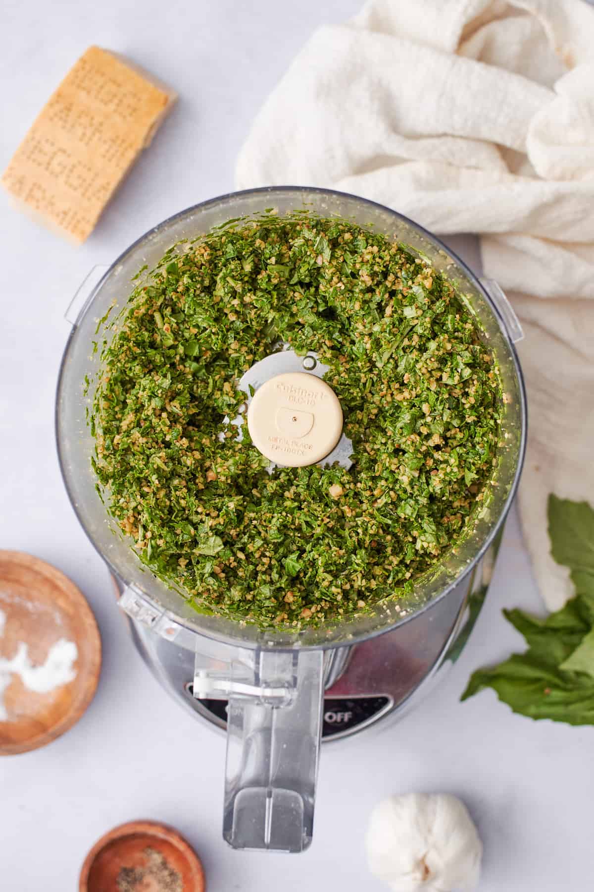 Basil, cheese, and walnuts pulsed together in a food processor.