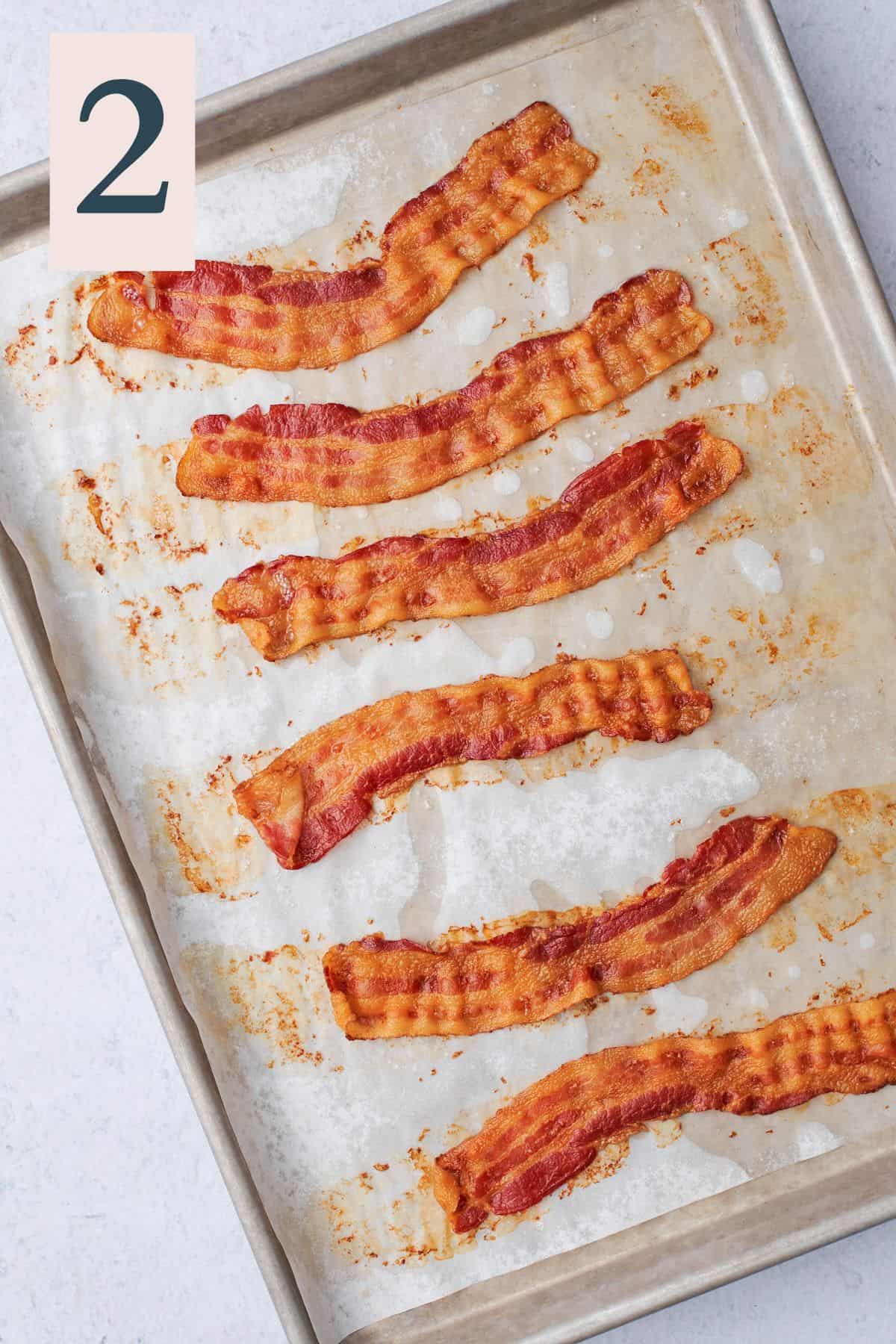 cooked crispy bacon on a baking sheet. 