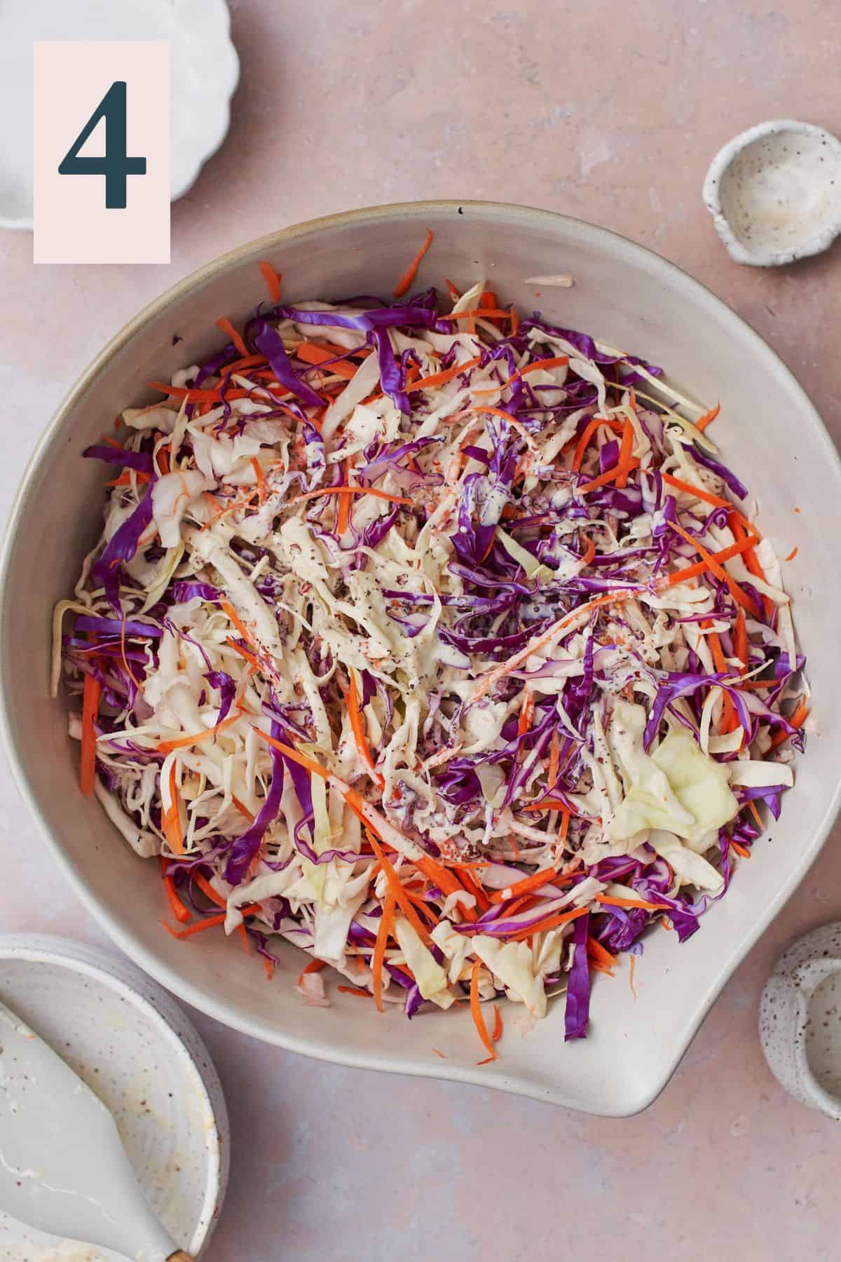 Shredded cabbage topped with dijon, mayonnaise, and yogurt sauce.