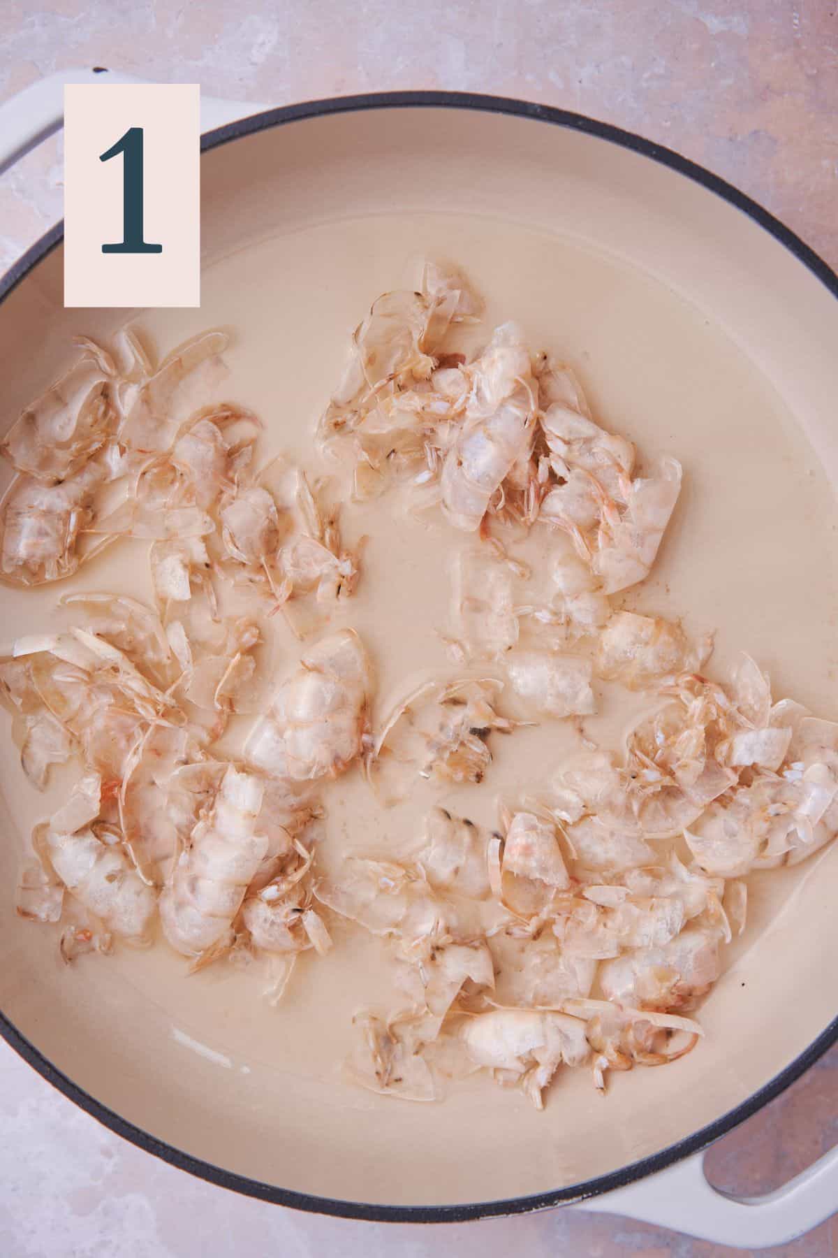 shrimp shells in white wine in a large deep skillet.