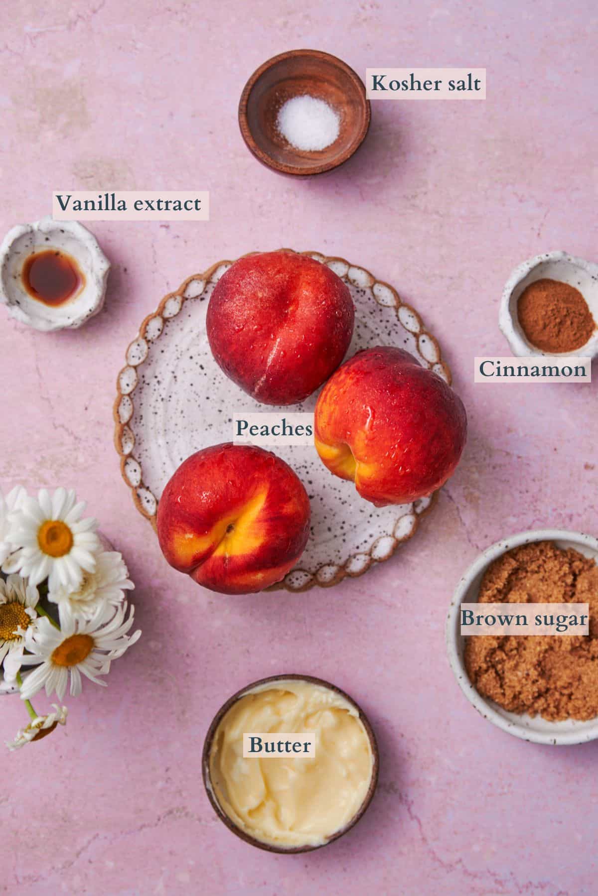 ingredients to make air fryer peaches with each ingredient labeled to denote each ingredient. 