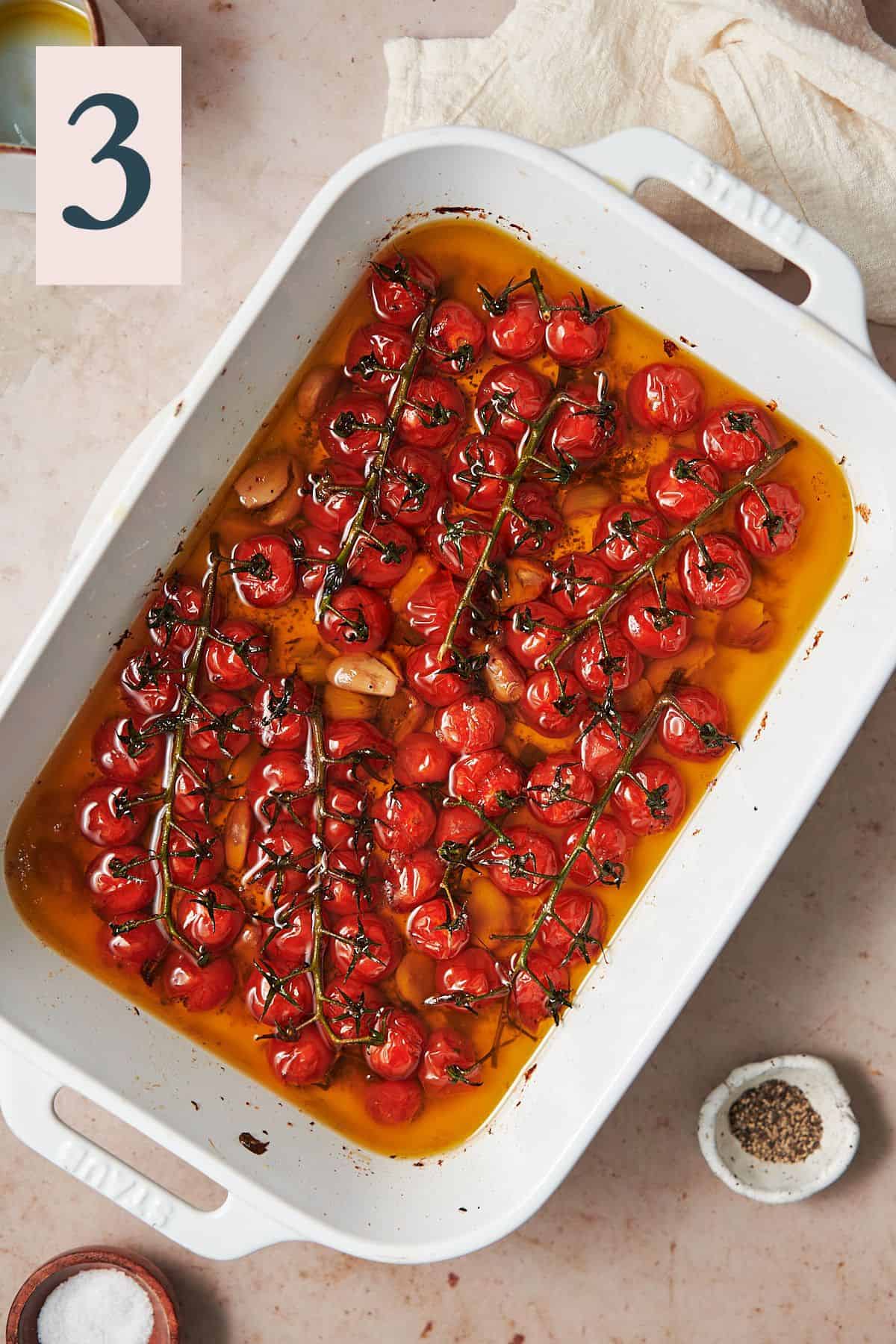 cherry tomato confit in a large baking dish and ready to eat. 
