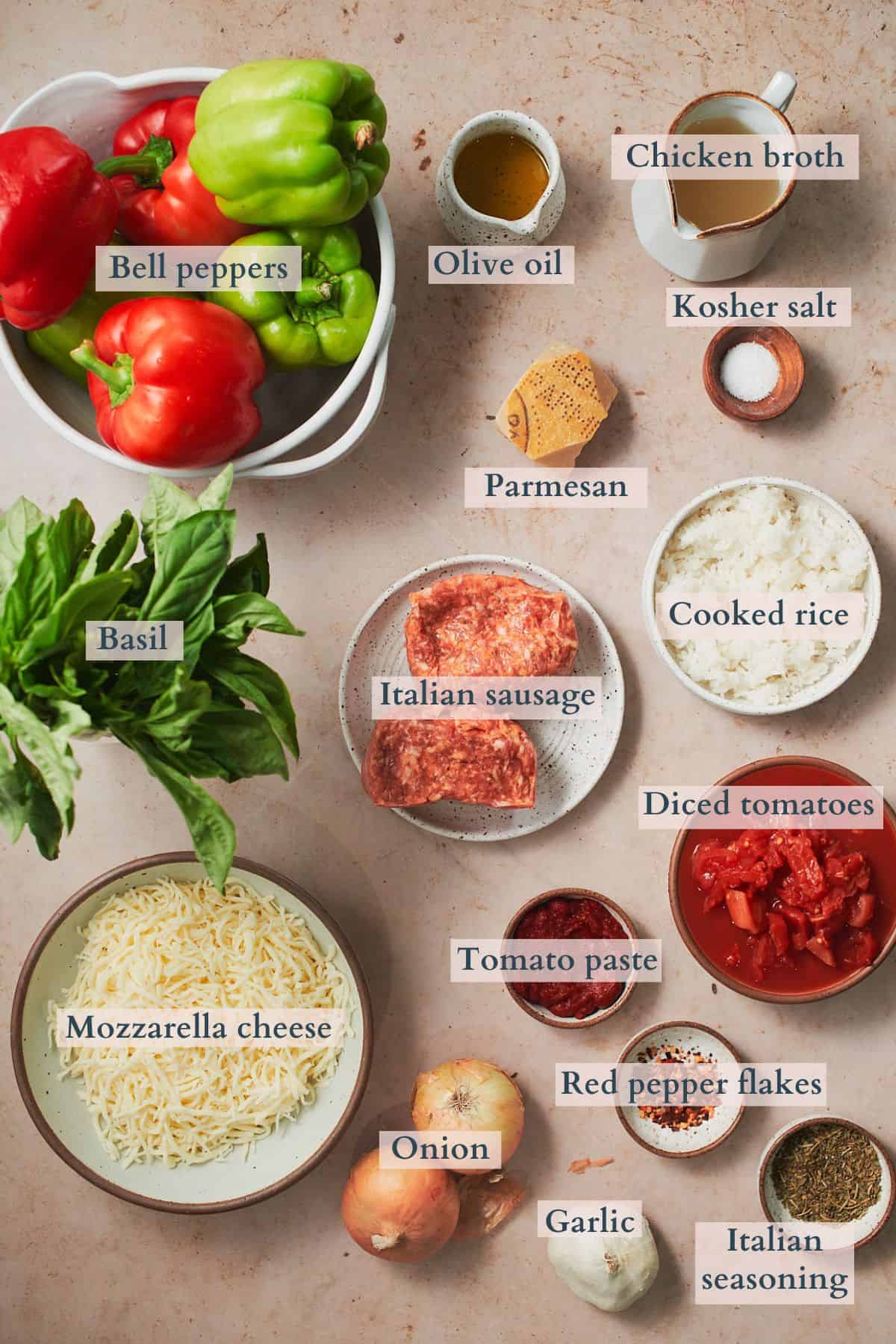 ingredients to make Italian sausage stuffed peppers laid out in small bowls and labeled to denote each ingredient. 