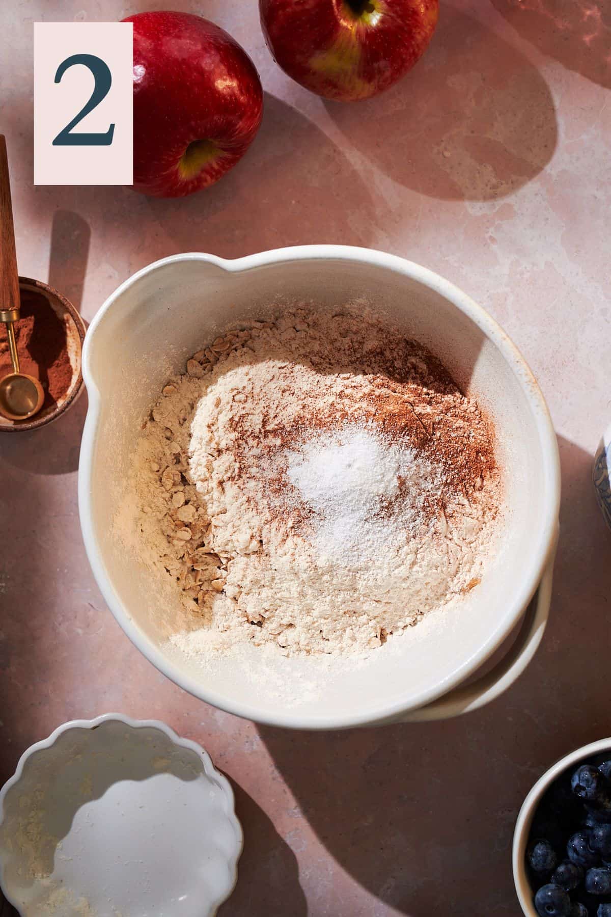 mixture of flour, oats, salt, and cinnamon in a bowl. 