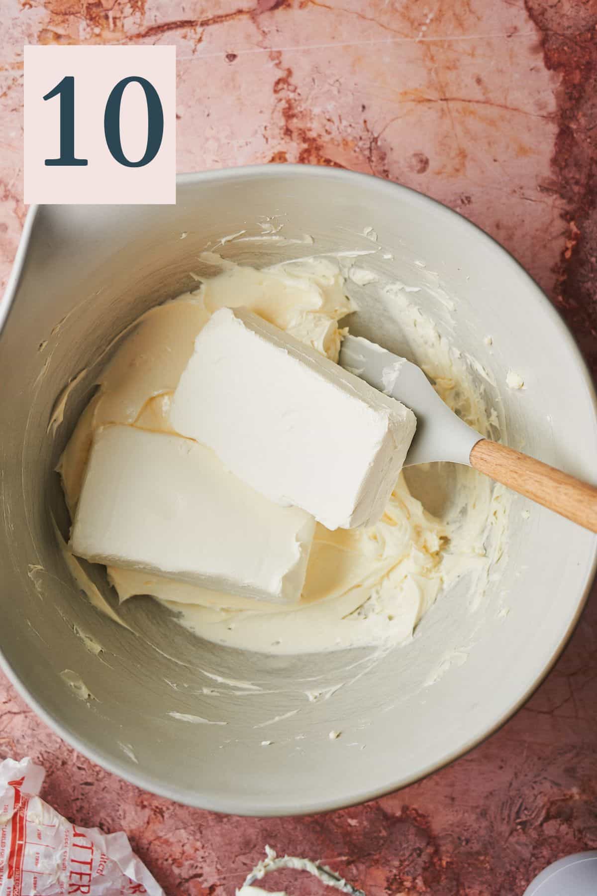 softened butter in a large mixing bowl with cream cheese.