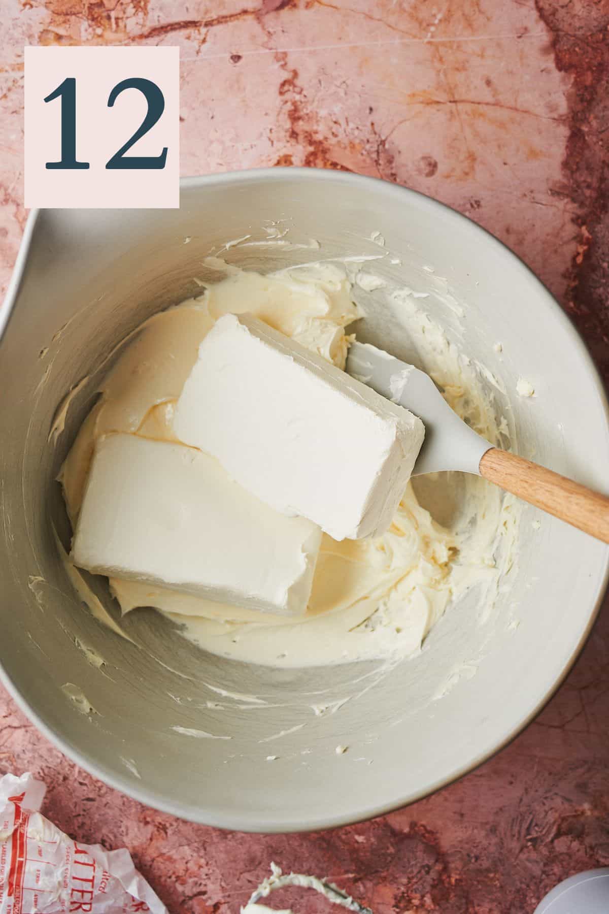 blocks of cream cheese in a bowl with butter. 
