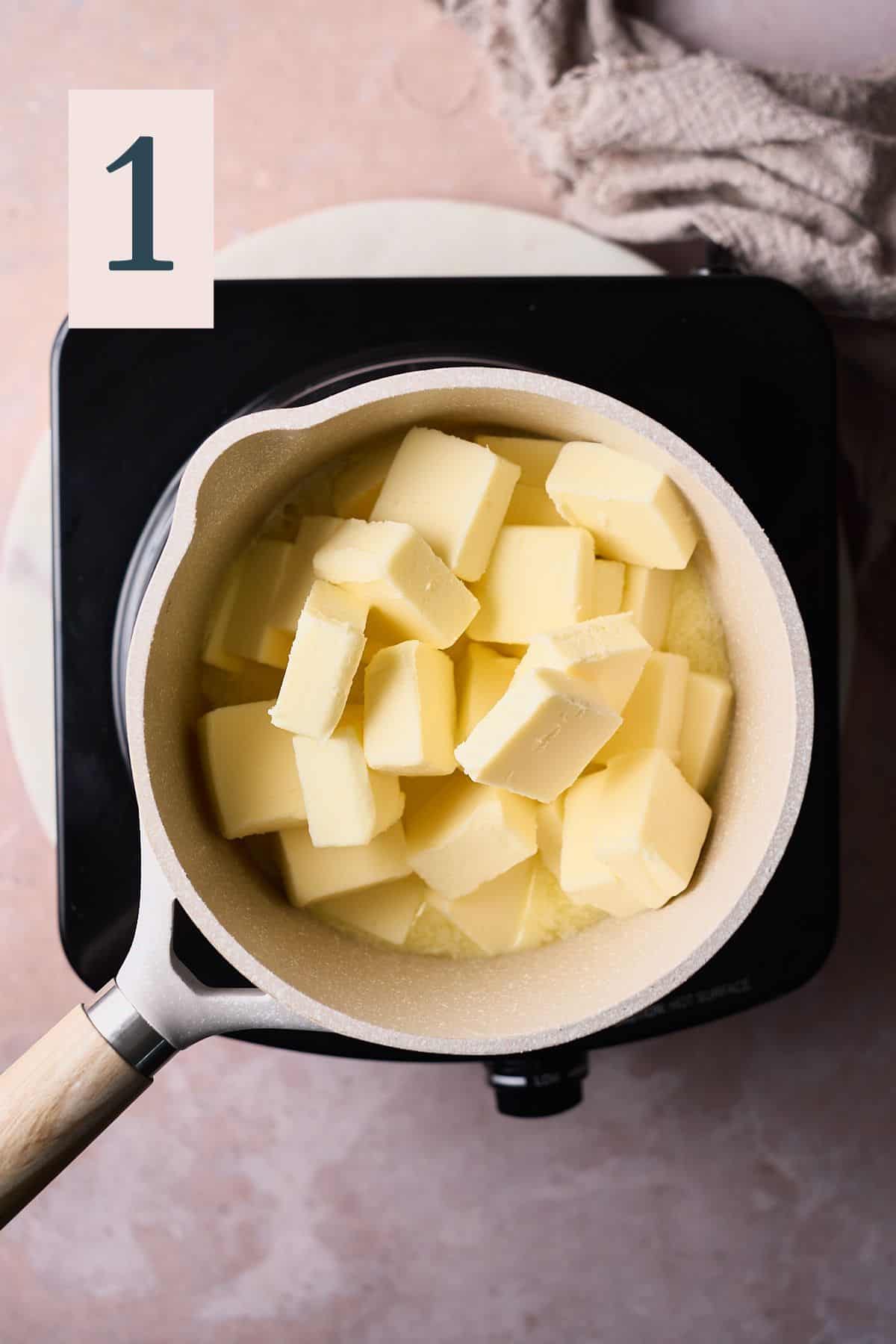 chunks of butter in a light colored saucepan. 