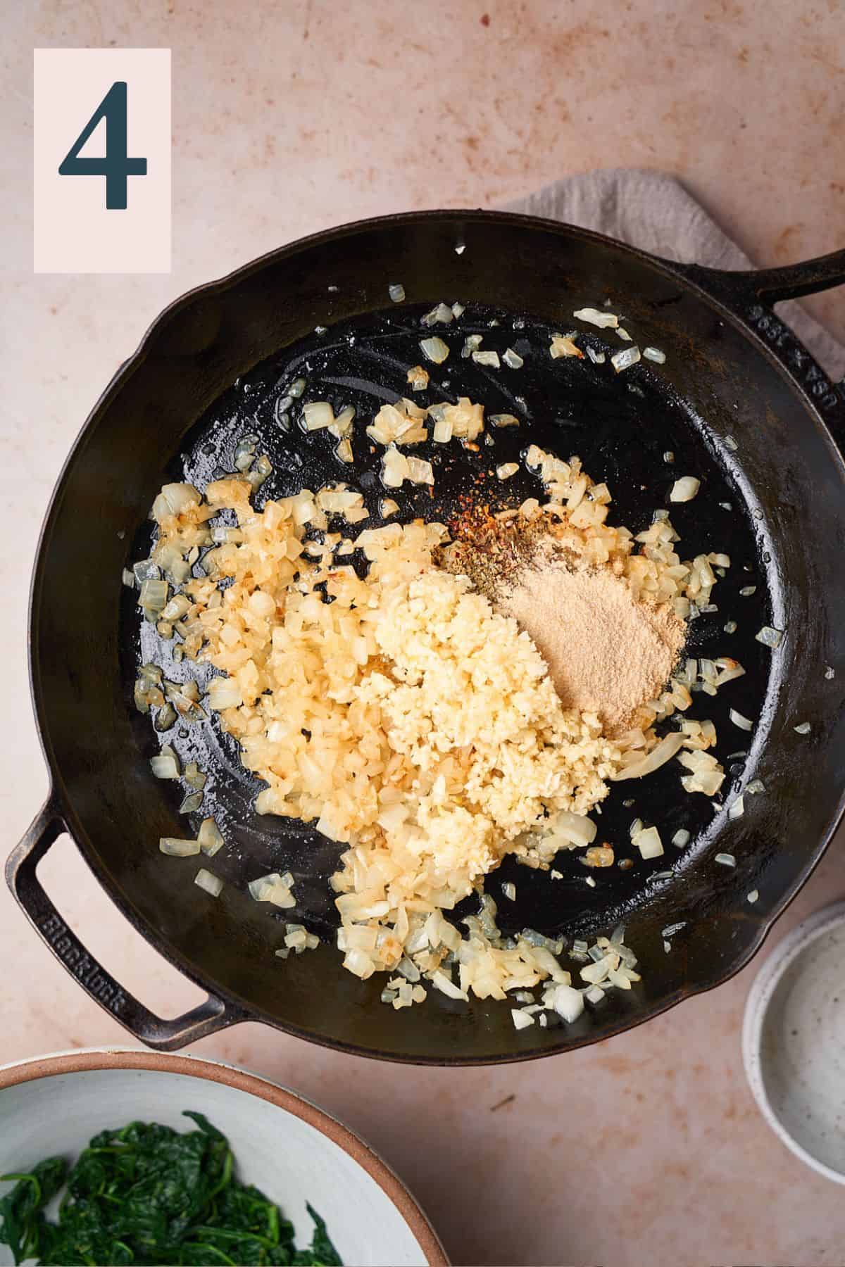cooked onion in a hot skillet with garlic and dry seasonings added. 